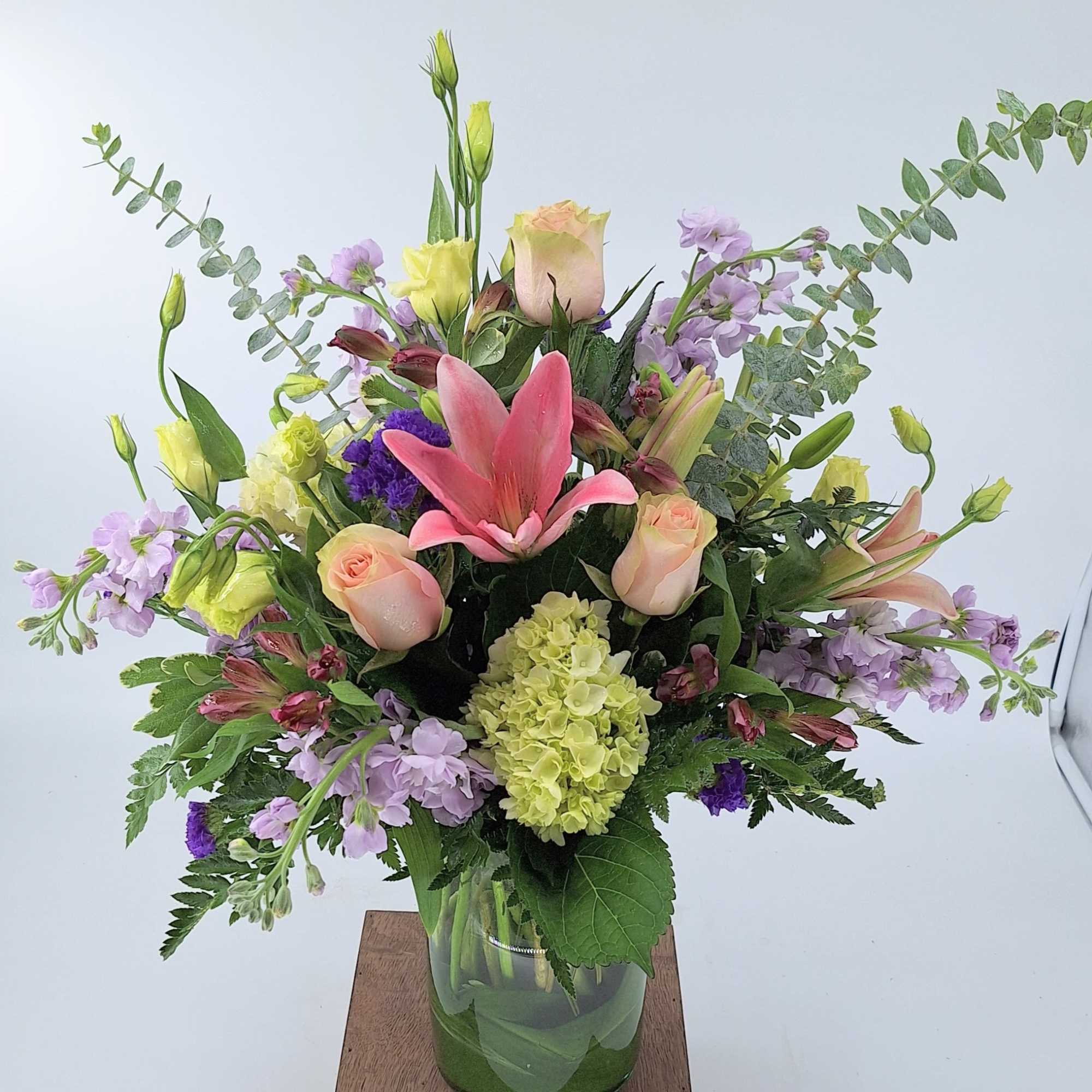 Elevate your space with our contemporary floral arrangement, featuring a vibrant mix