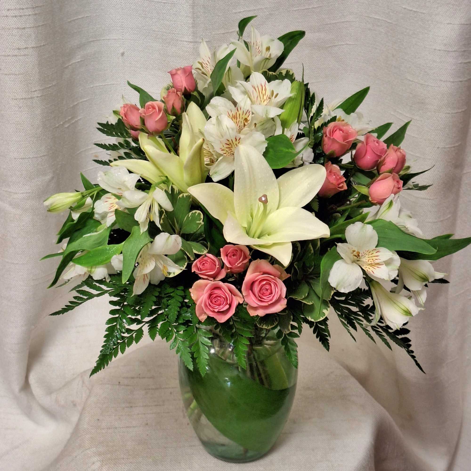 Introducing a stunning flower arrangement that exudes elegance and charm. This exquisite