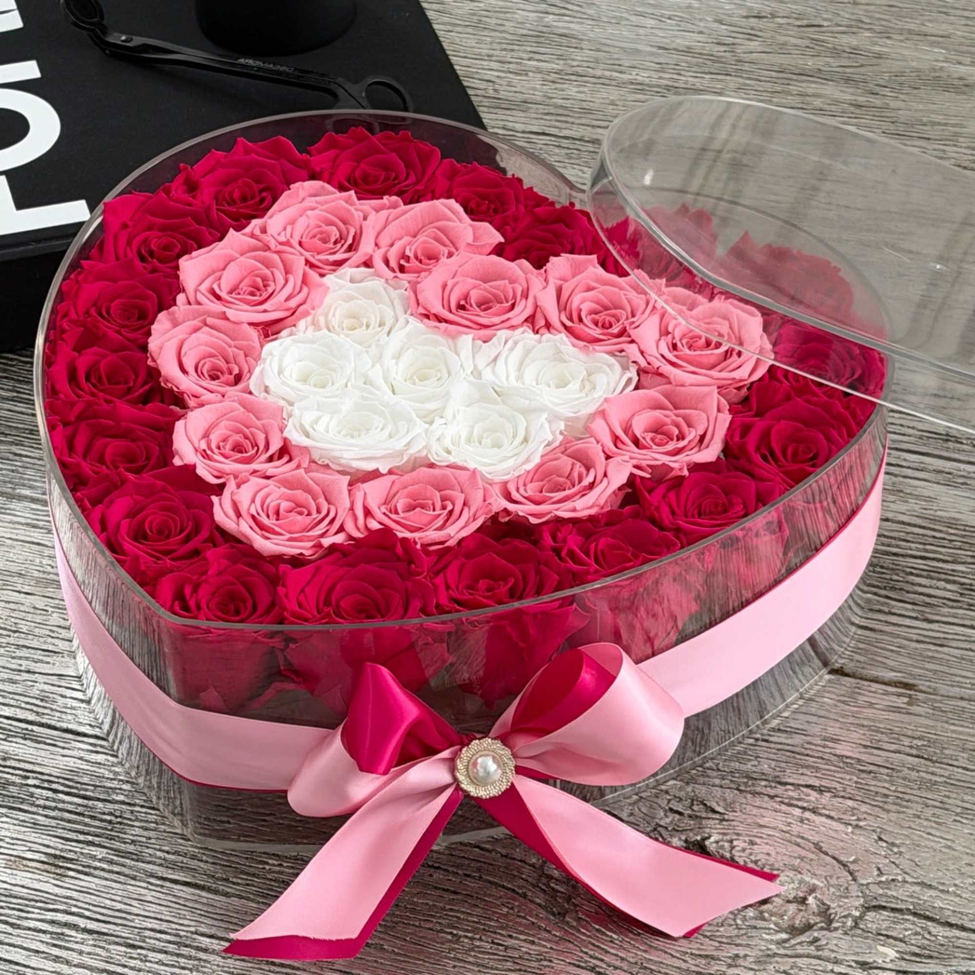 Soft, romantic, and beautifully detailed, this heart-shaped arrangement features premium preserved roses
