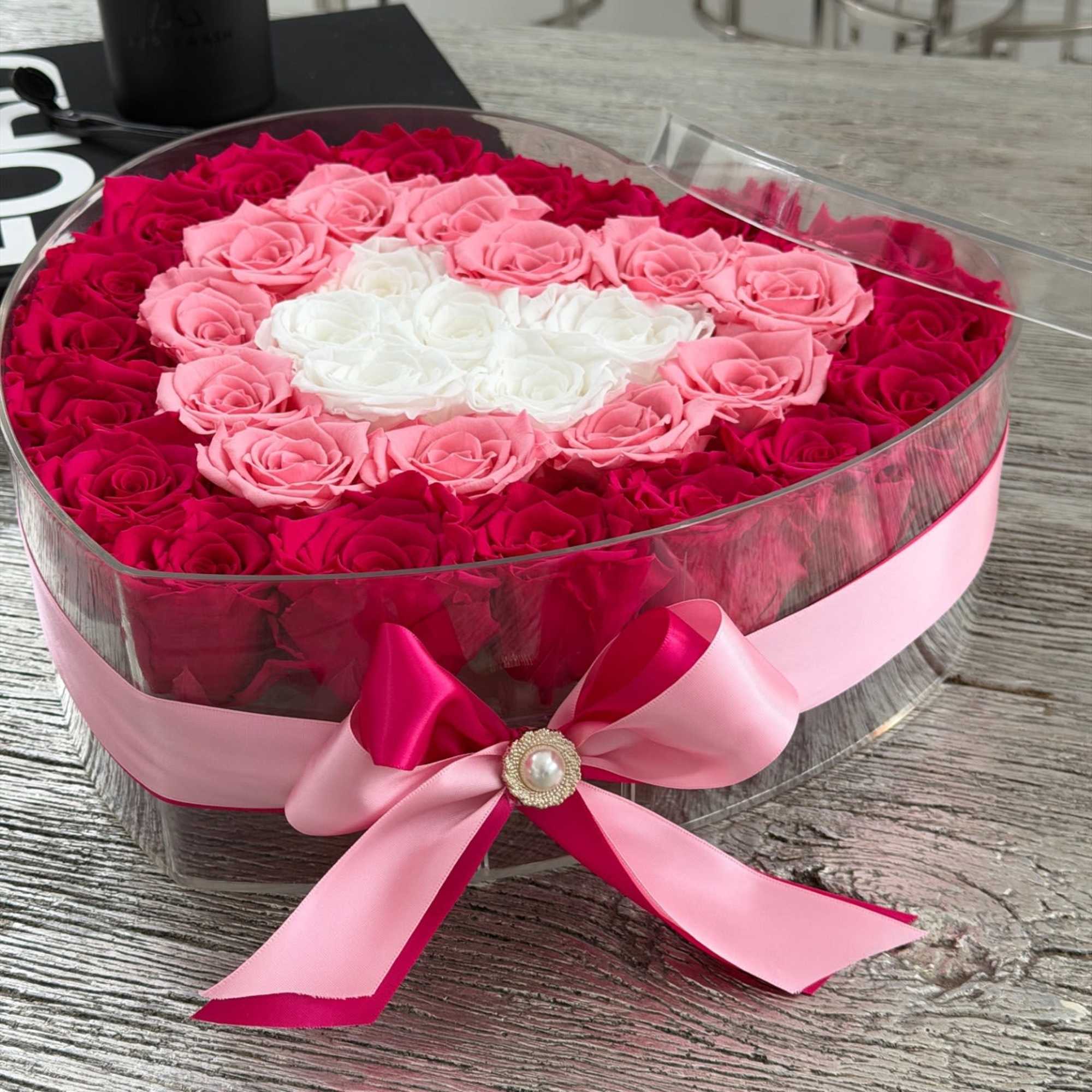 Soft, romantic, and beautifully detailed, this heart-shaped arrangement features premium preserved roses