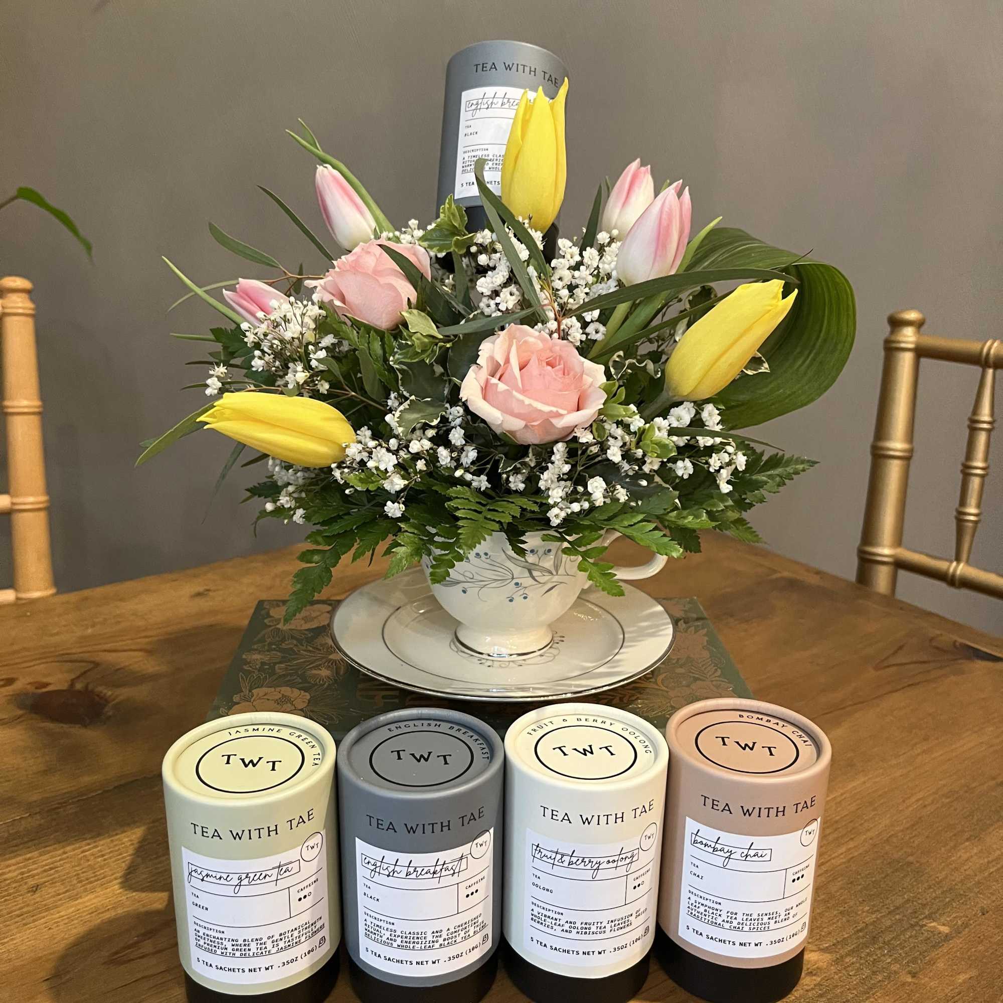 A mix of garden blooms designed in a vintage tea cup. Each