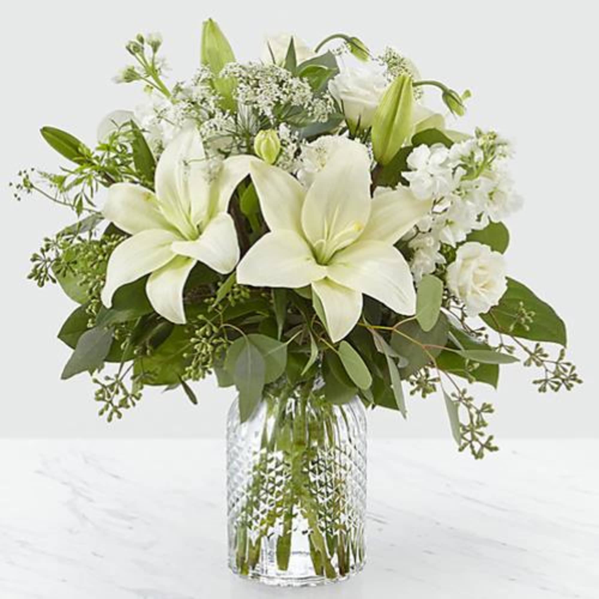 Our Alluring Elegance Bouquet is a striking array of ivory and green.