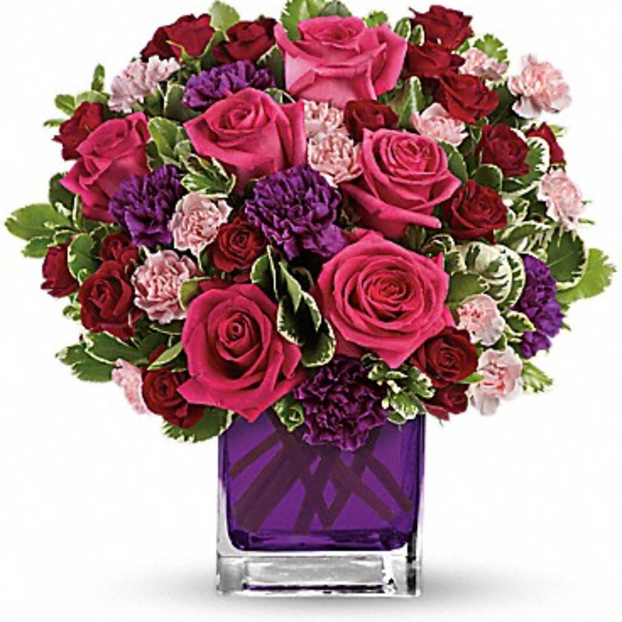 Pure romance. Hot pink roses and dark red spray roses are brightly