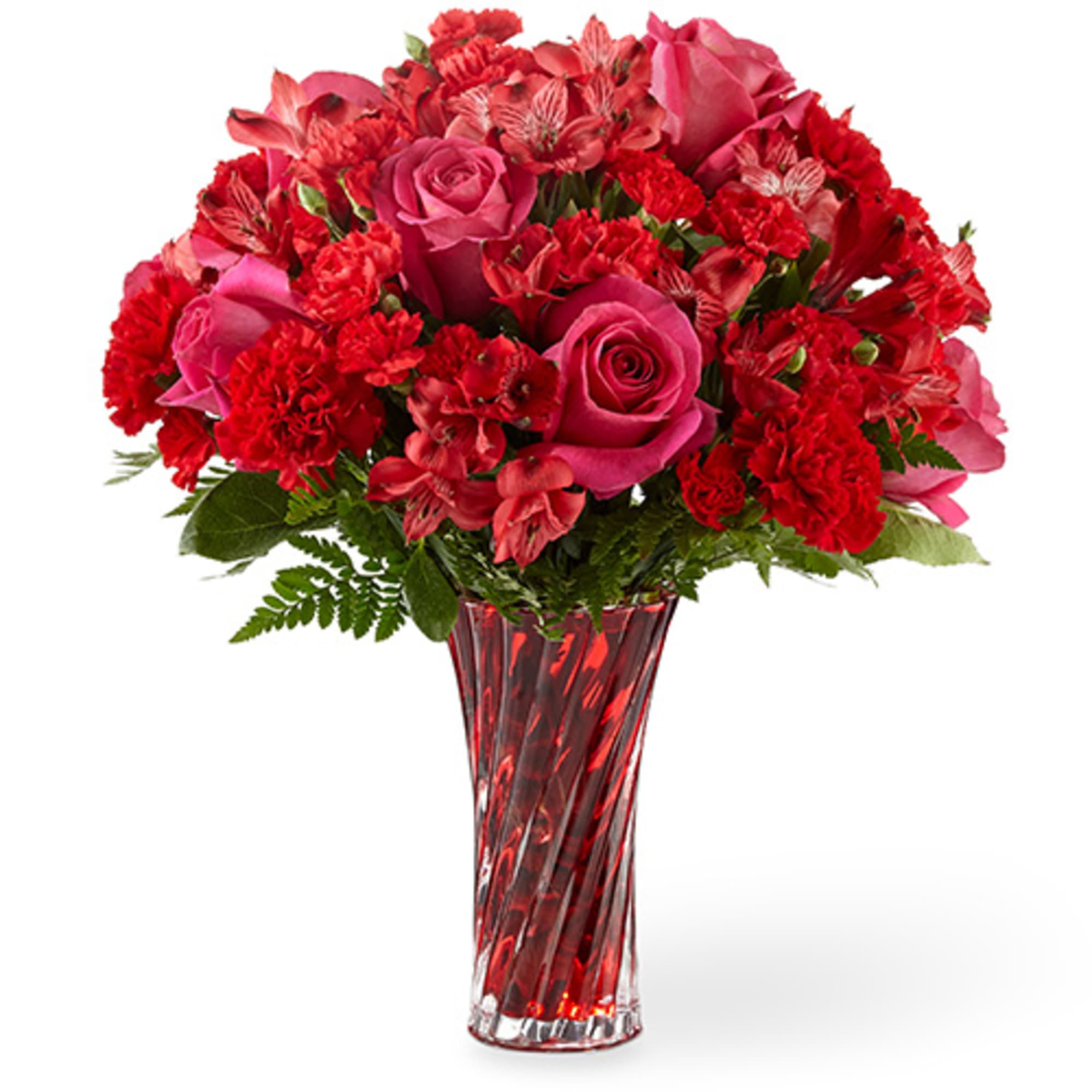 Red roses and carnations in a tall red glass vase