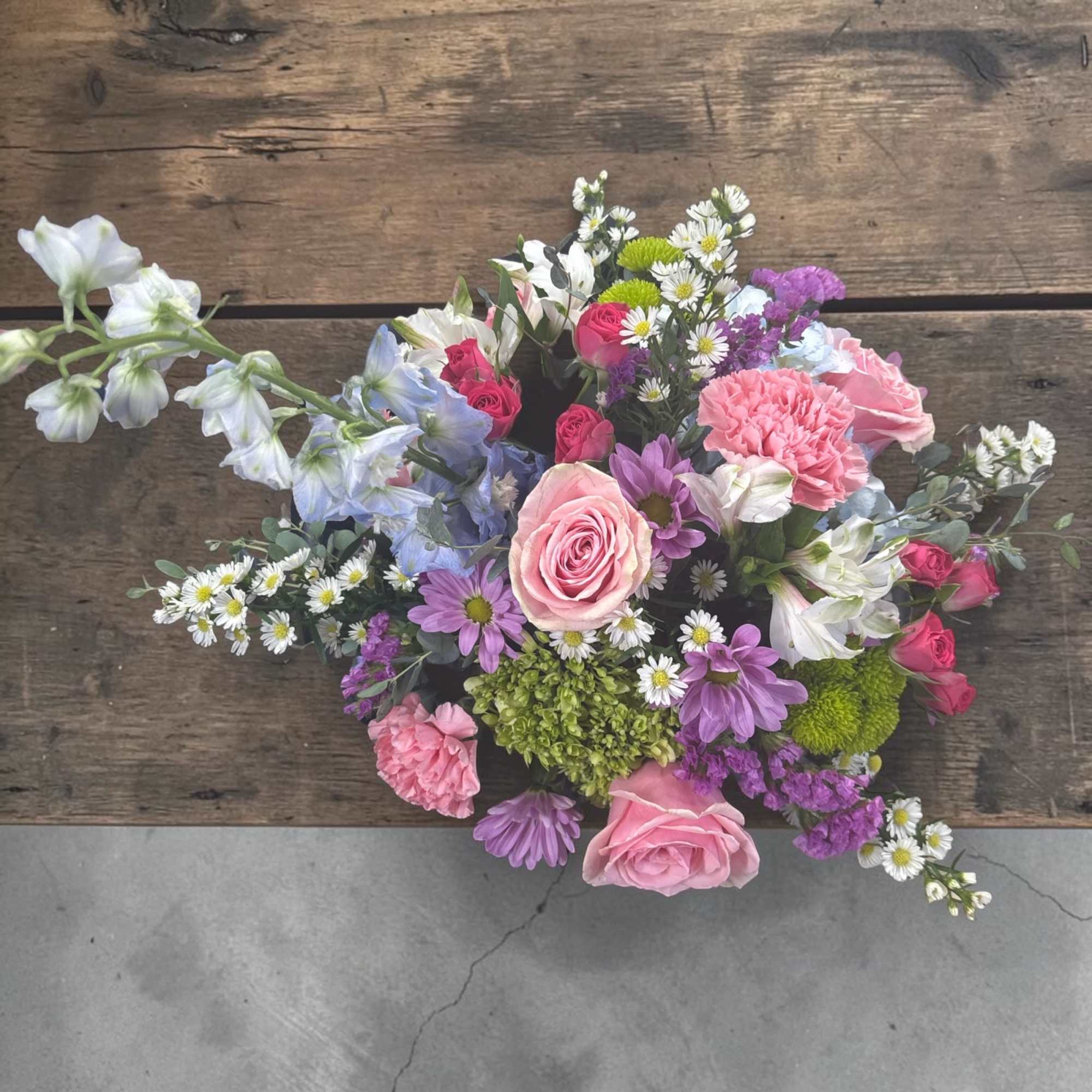Fluttering Garden Bouquet is a fresh, garden-inspired floral arrangement designed in a