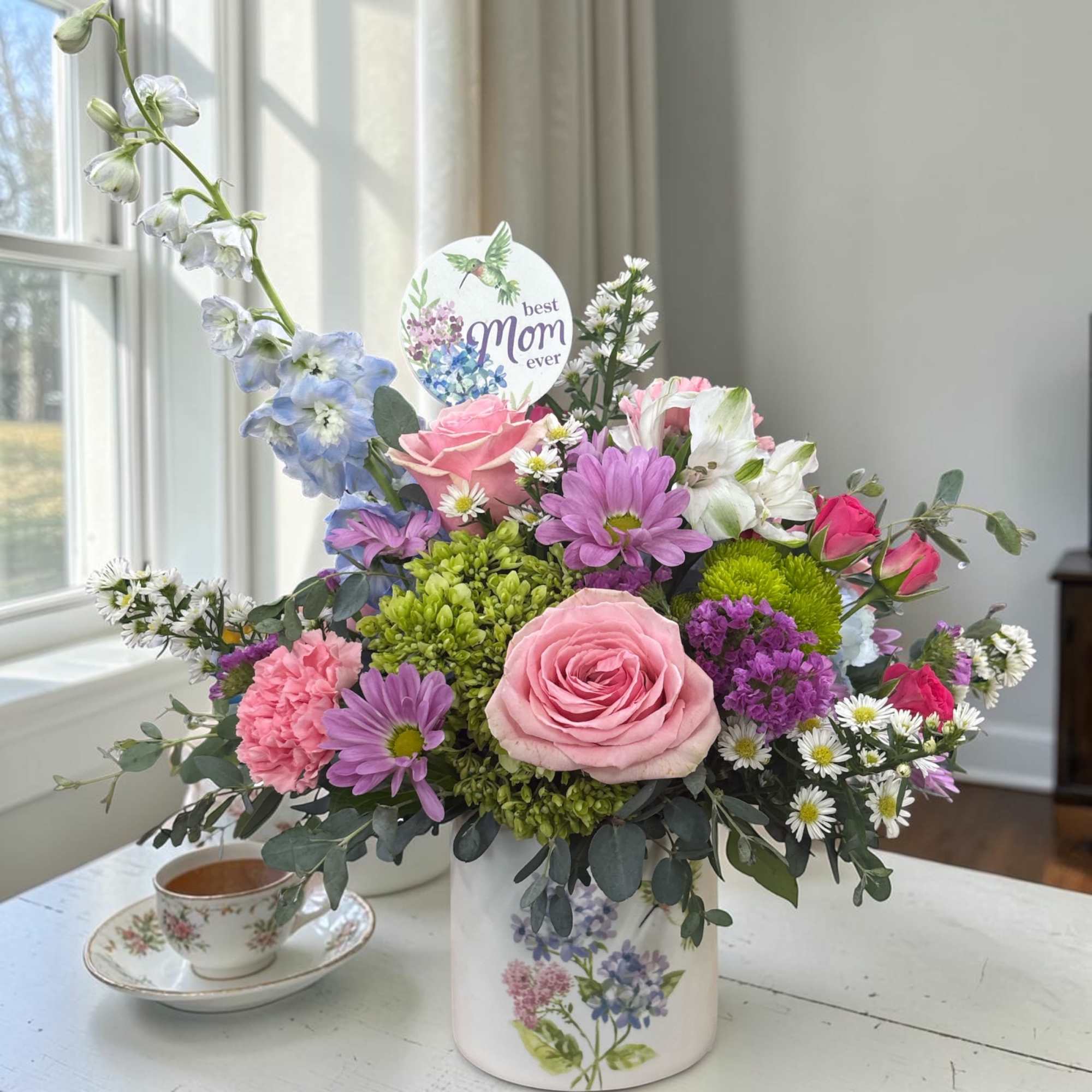 Fluttering Garden Bouquet is a fresh, garden-inspired floral arrangement designed in a