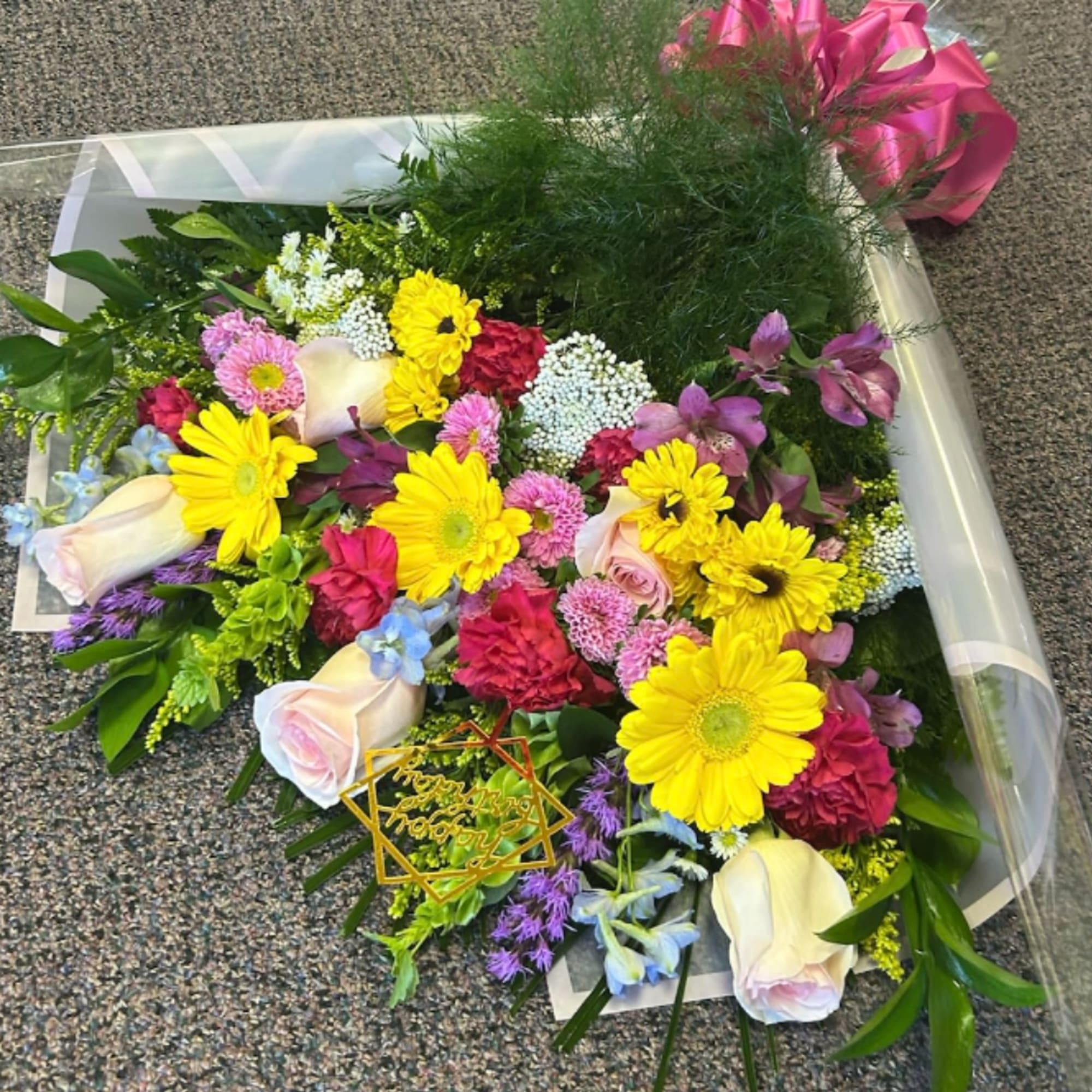 Bursting with bright, celebratory color, this Congrats Grad! Designer's Choice presentation bouquet
