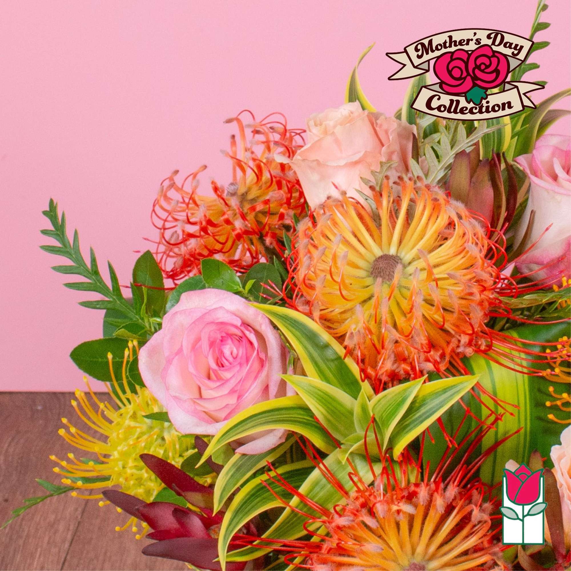 Bright bouquet with pink roses and orange-yellow pincushion protea against a pink background.
