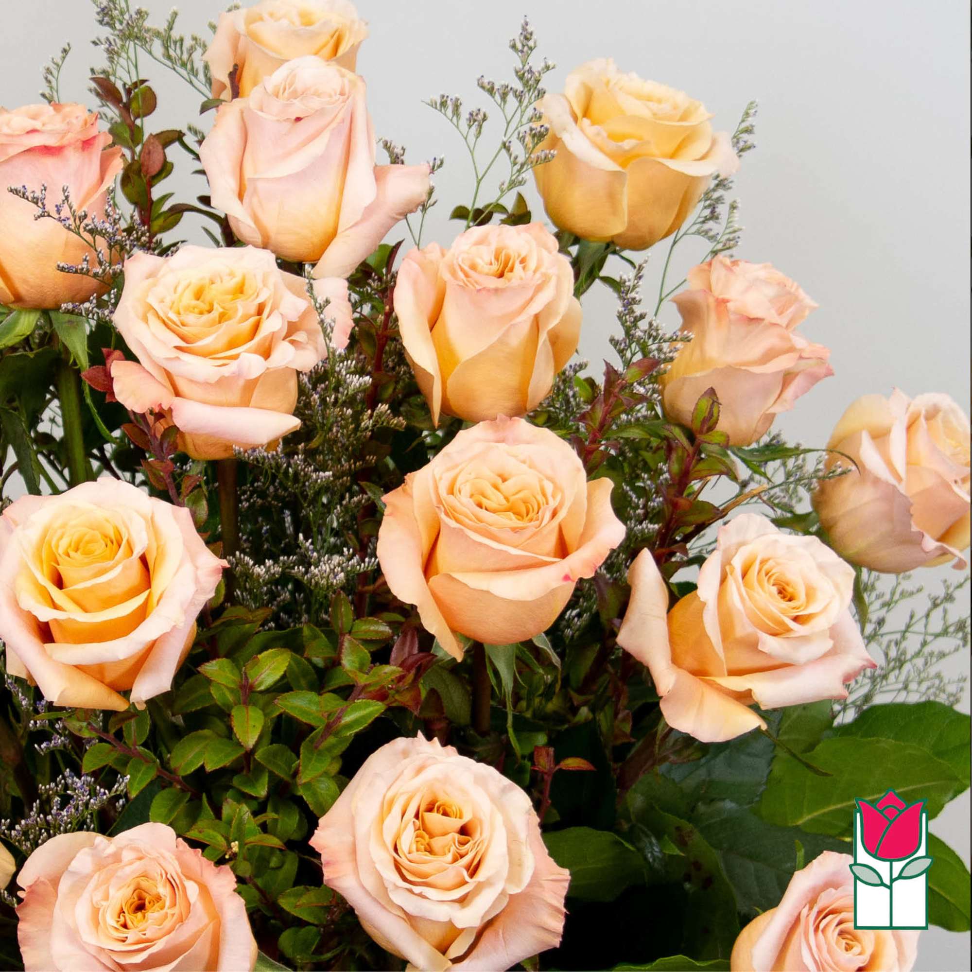 Bouquet of peach roses with mixed greenery