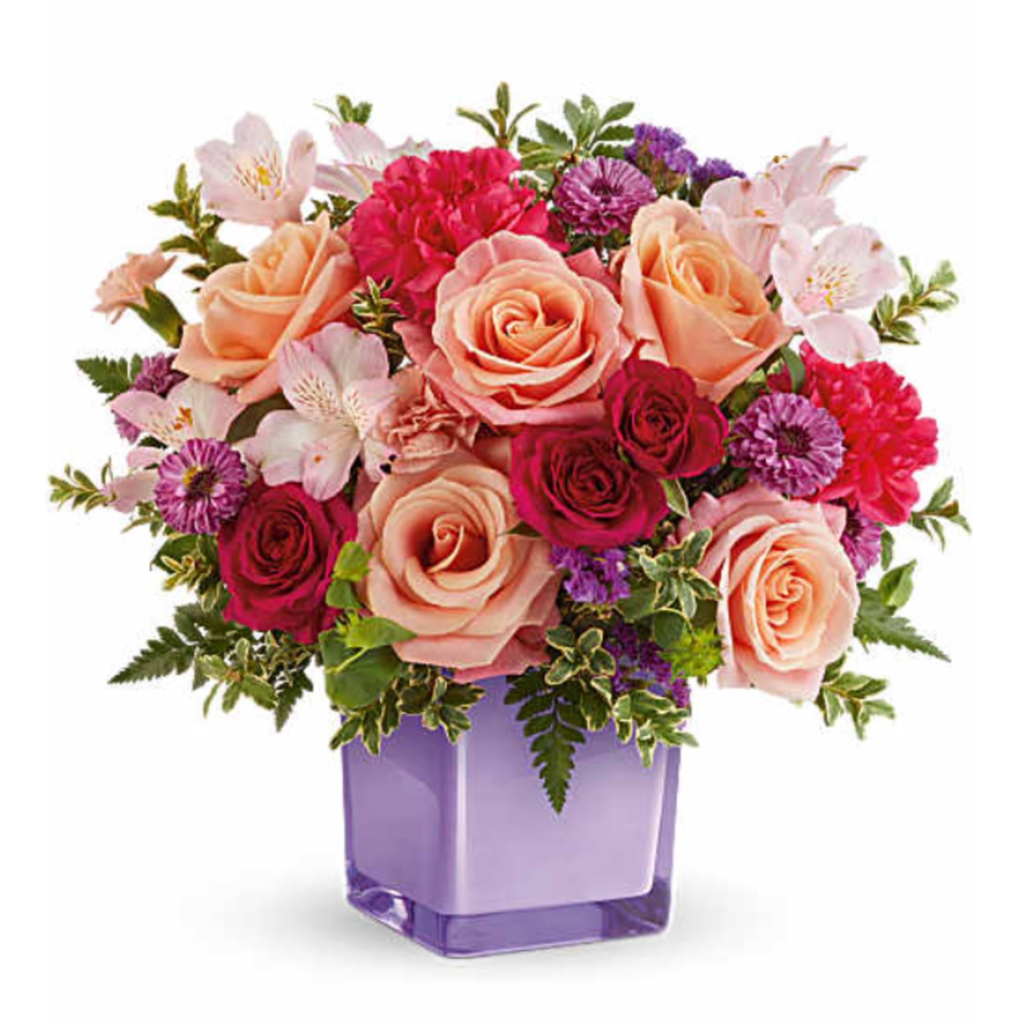 Teleflora's Sunset Sorbet Bouquet includes peach roses, hot pink spray roses, light