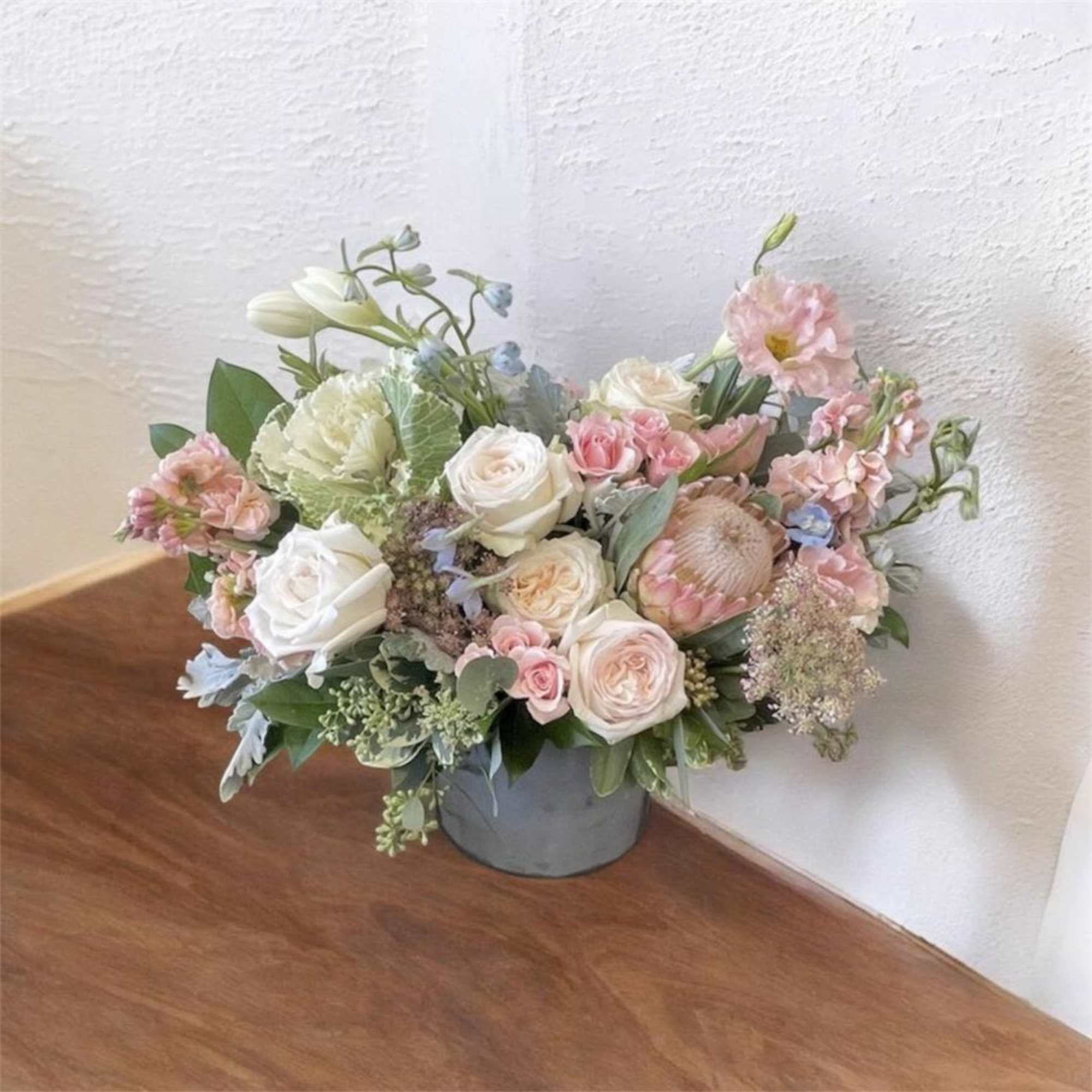 Theme Colors: Shades of white, pink and green

Featured Blooms: Roses, Delphiniums, Cabbage