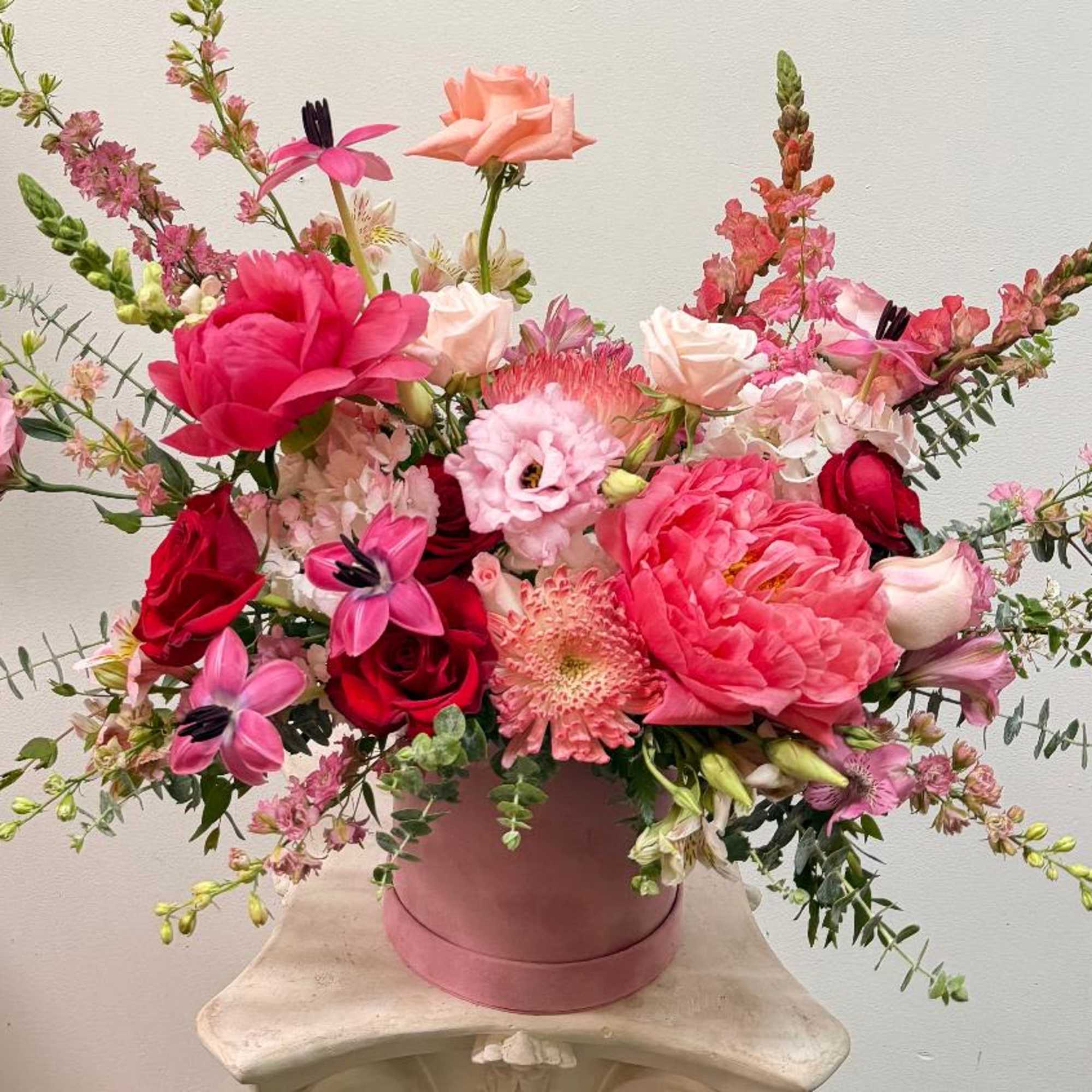 Theme Colors: Shades of pinks and Red

Featured Blooms: Roses, Tulips, Peony, Spider