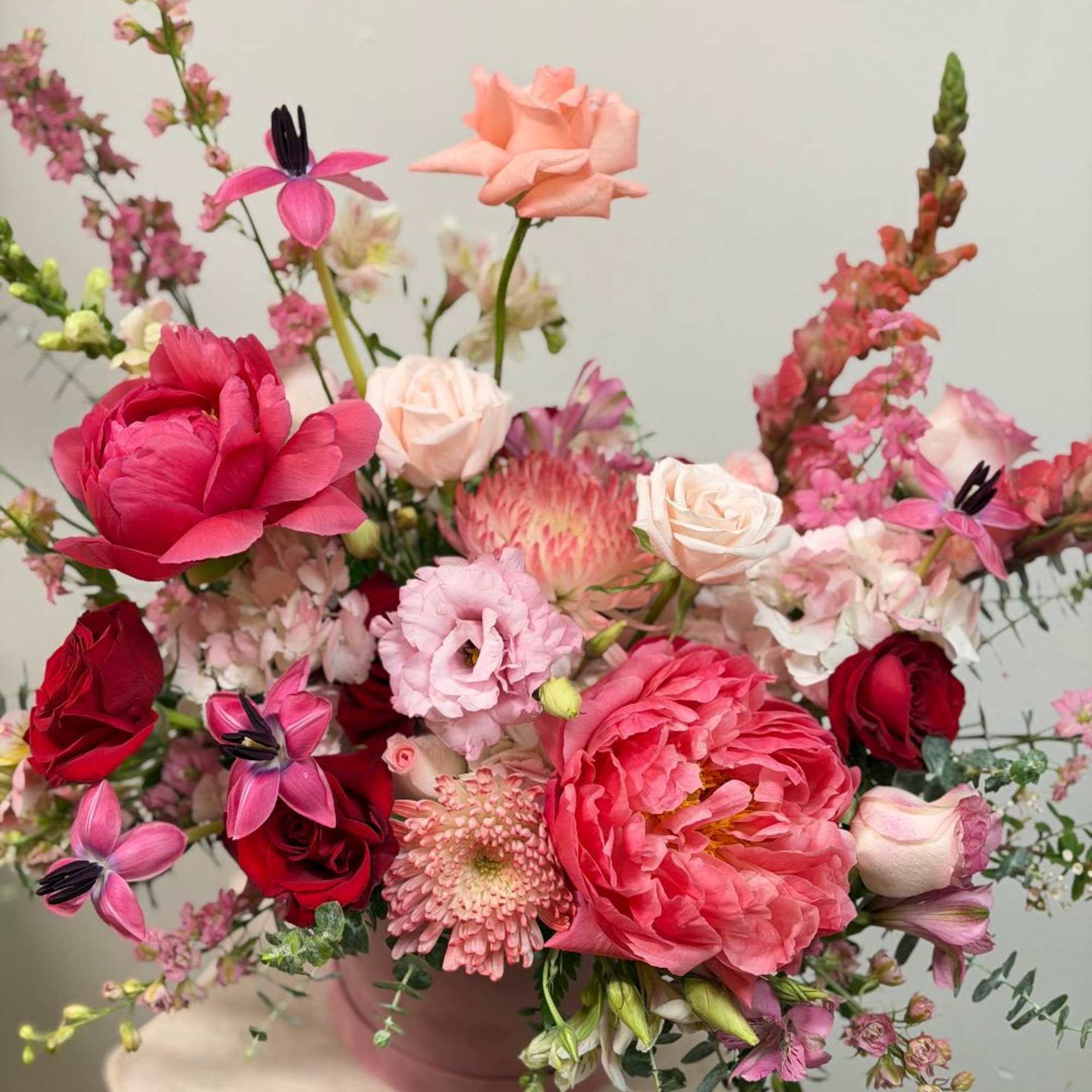 Theme Colors: Shades of pinks and Red

Featured Blooms: Roses, Tulips, Peony, Spider
