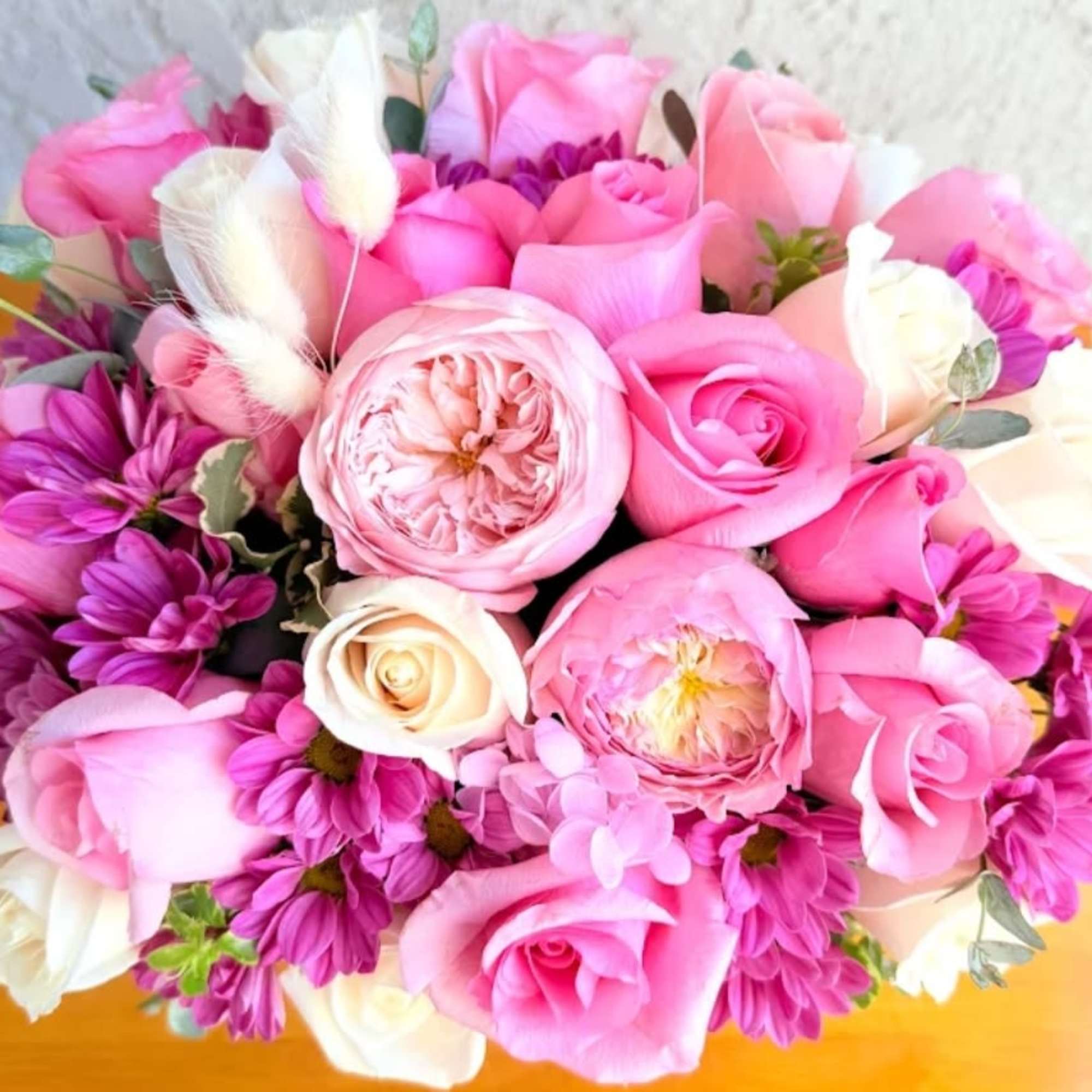 Pink and white rose bouquet with purple daisies