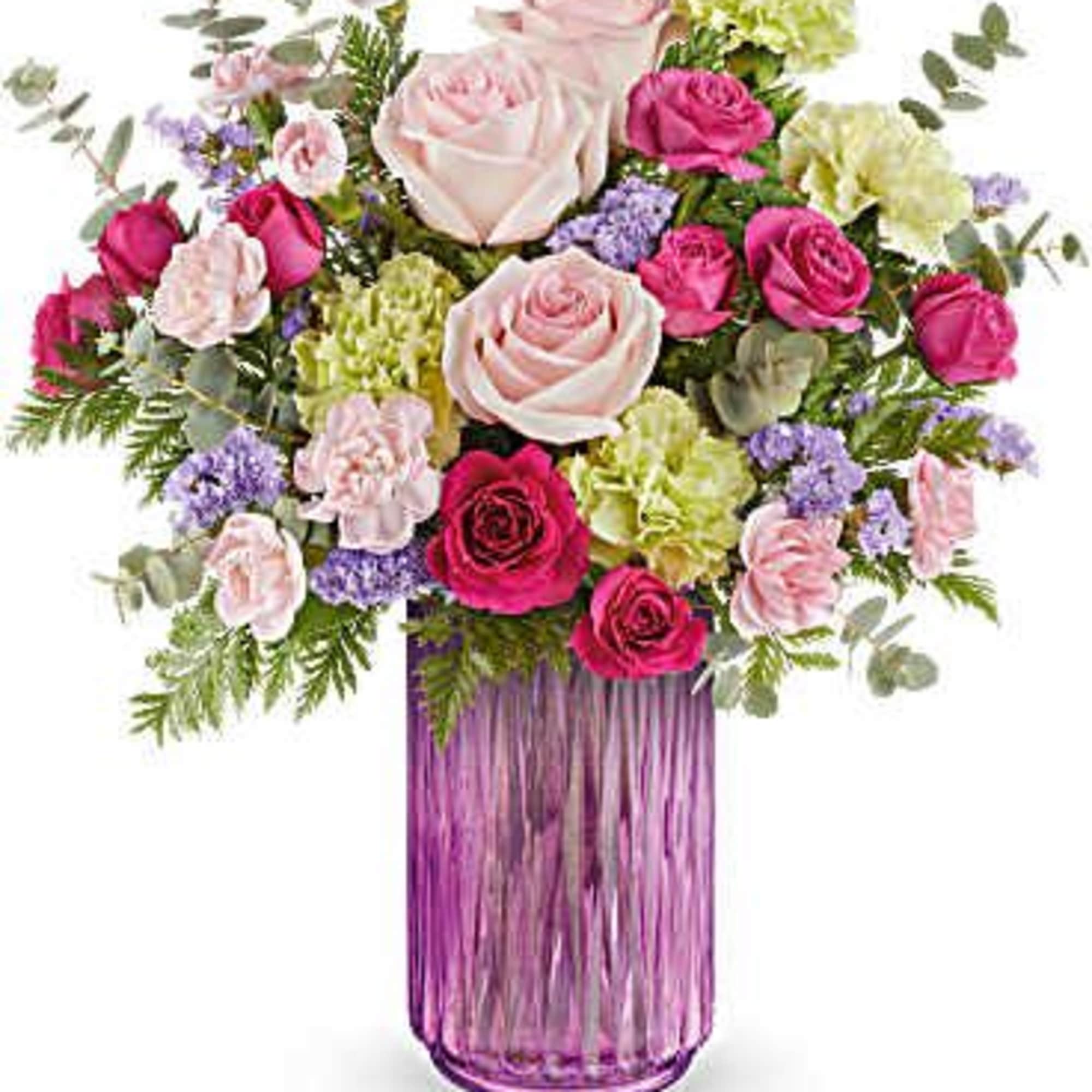 Pink and white rose bouquet in a purple glass vase
