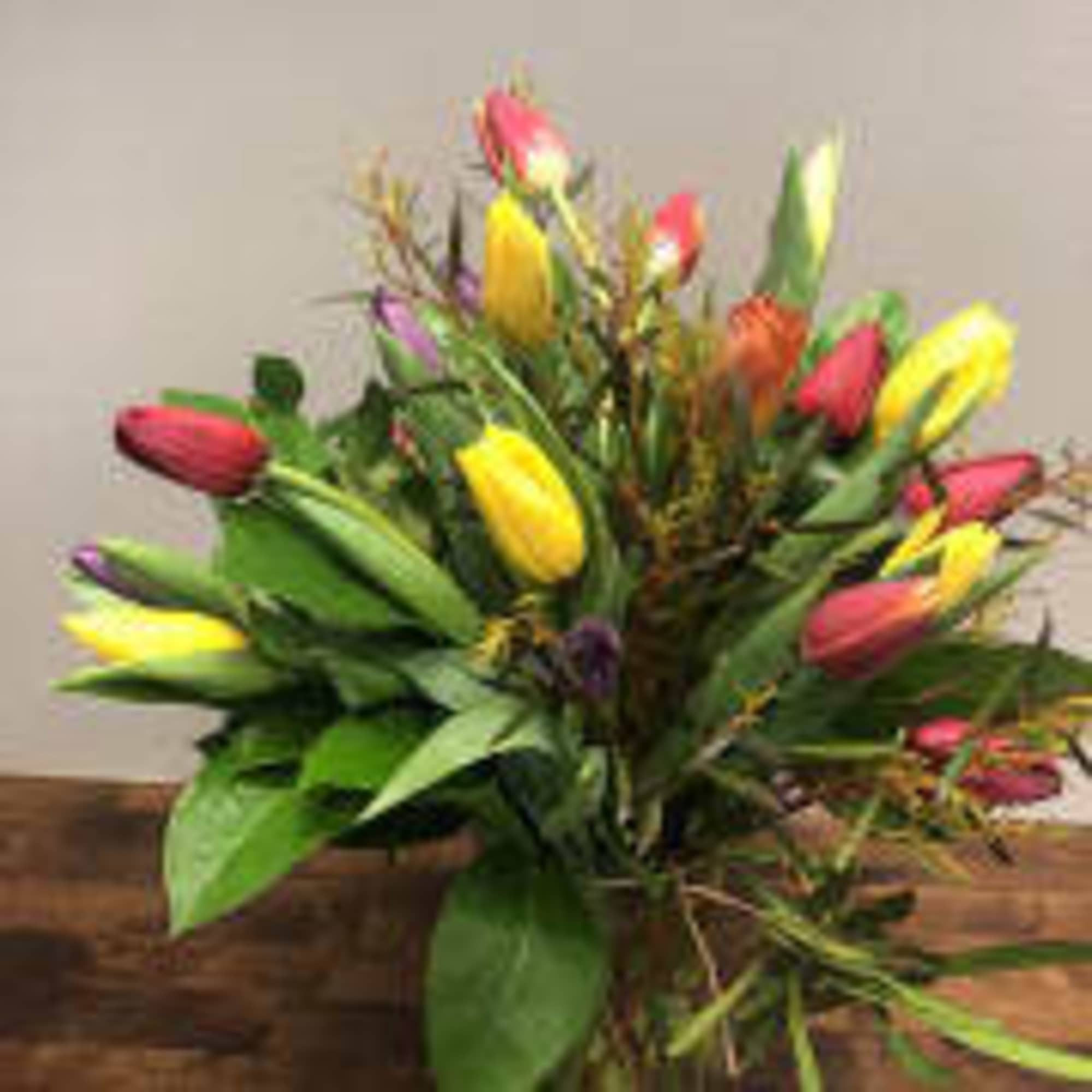 24 assorted tulips herald the arrival of the season, beautifully designed in