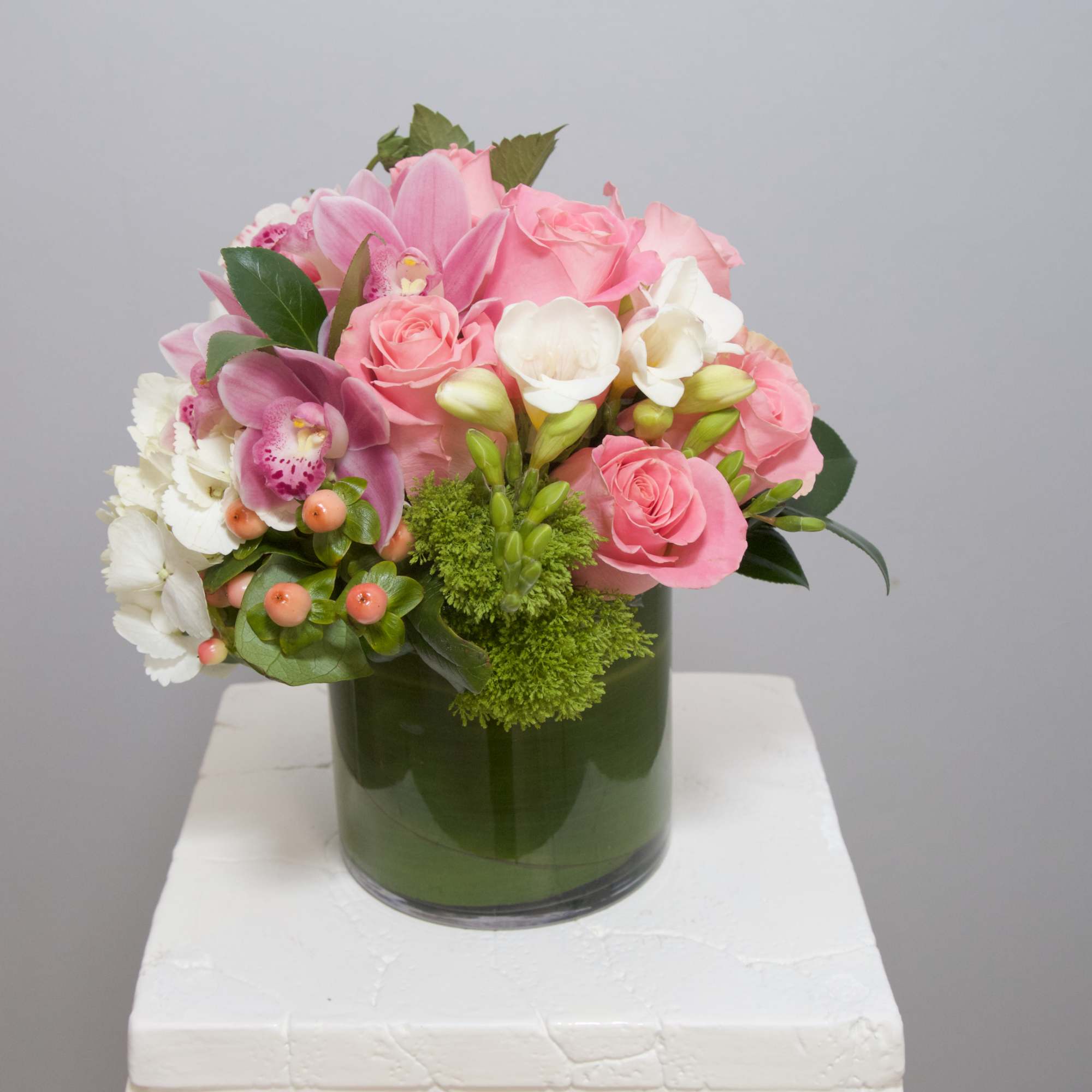 Crowd-pleasing Dahlias, championed pink Peonies and frosty Dusty Miller compose this choice