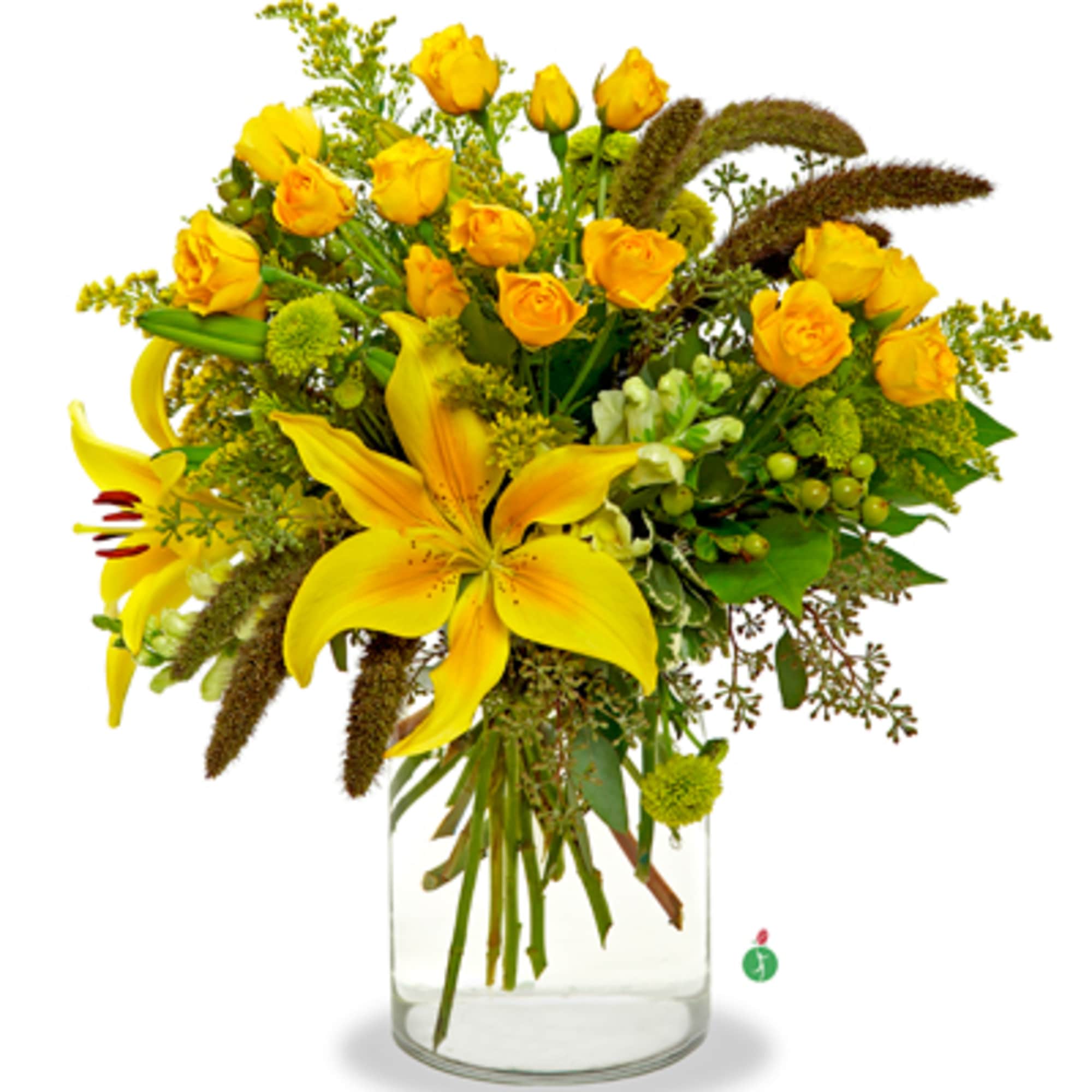 Yellow roses and lilies arranged in a clear glass vase