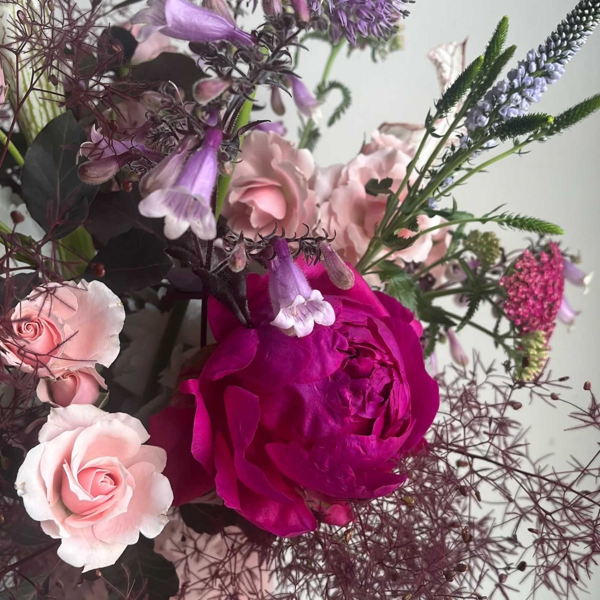 A graceful blend of soft blush and rich rosy pink blooms, Lady