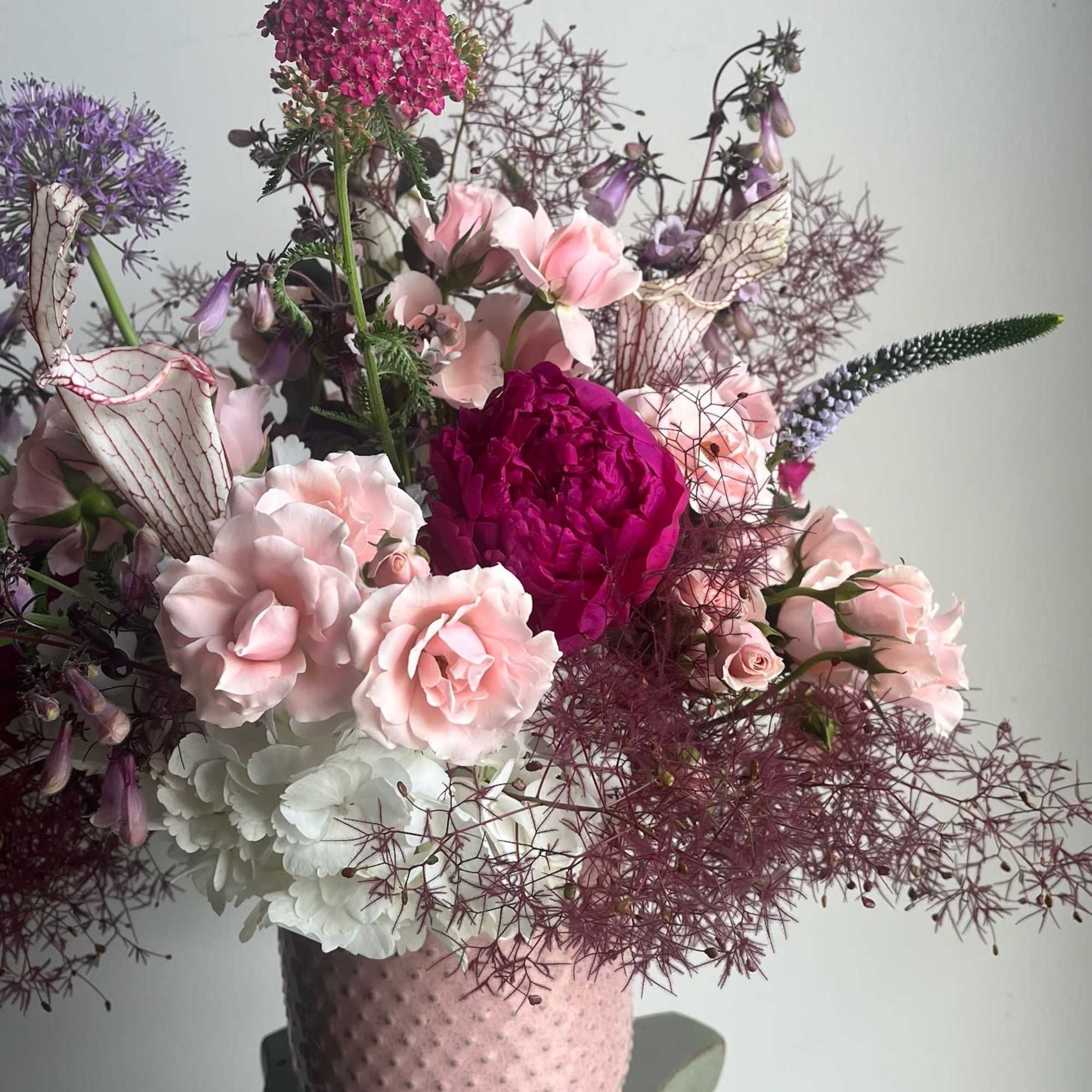 A graceful blend of soft blush and rich rosy pink blooms, Lady
