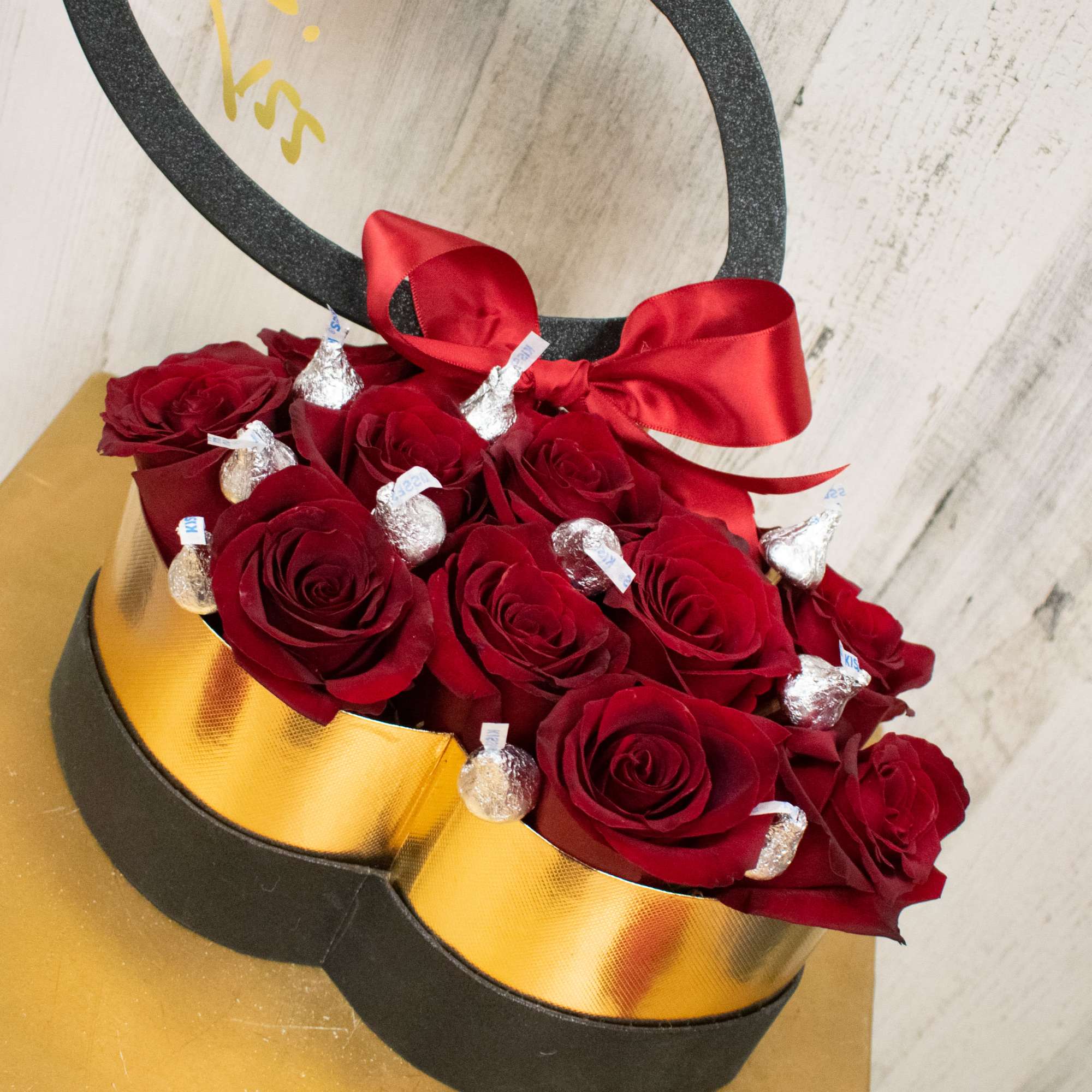 Send a sweet kiss! One dozen red roses with milk chocolate Hershey&rsquo;s