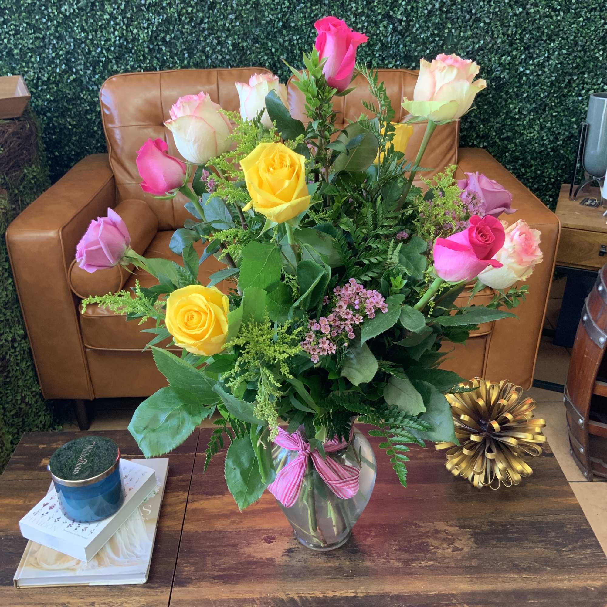Beautiful Ecuadorian long stem roses arranged tall in a glass vase with