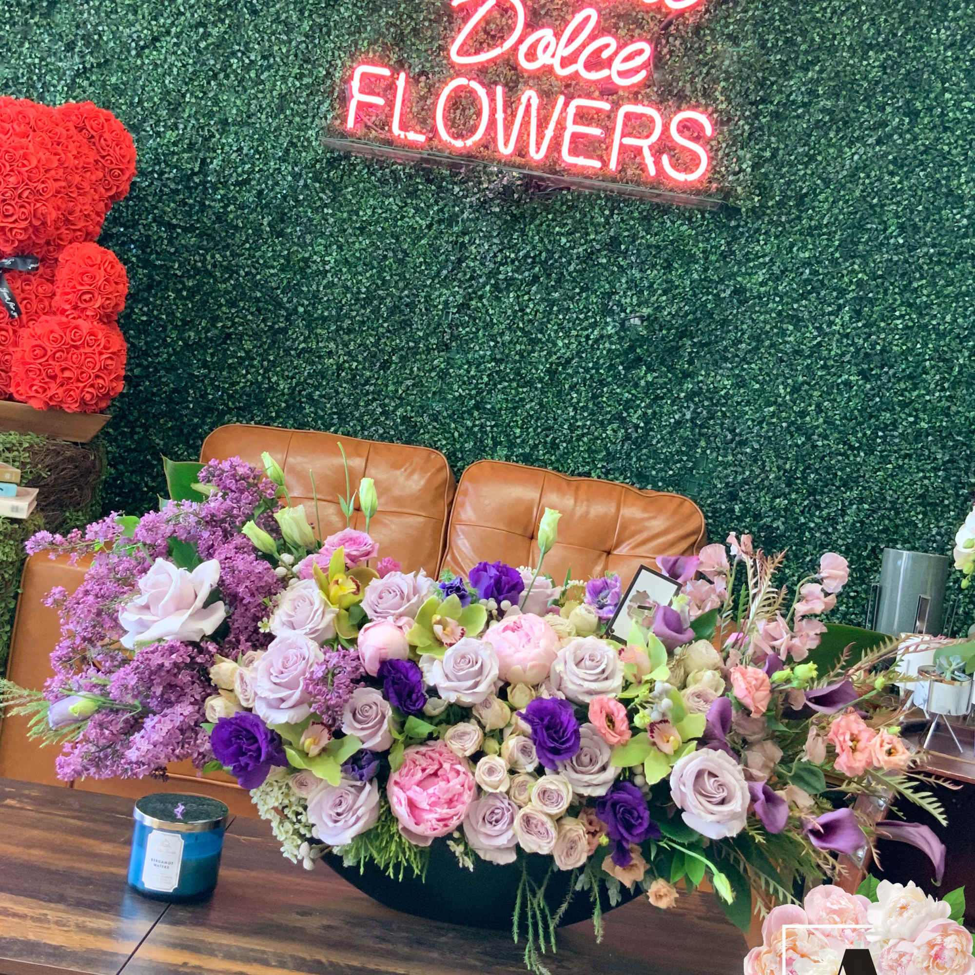 Lilacs, peonies, orchids oh my! Stunning unique floral arrangement sure to wow
