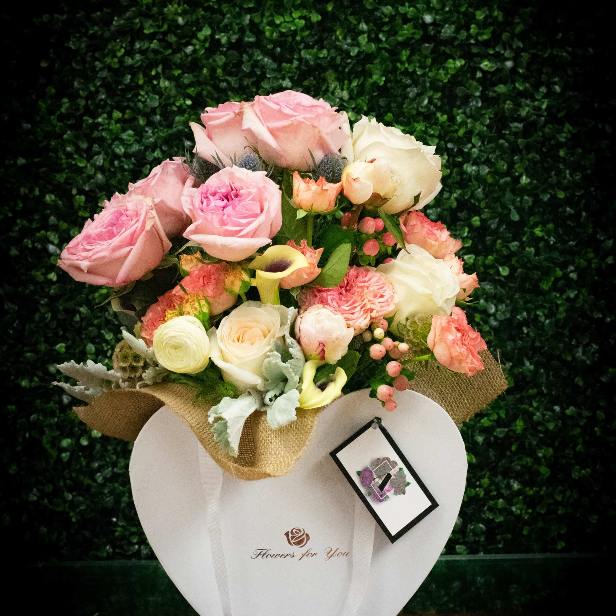 A beautiful custom designed bouquets  with assorted high end flowers. 