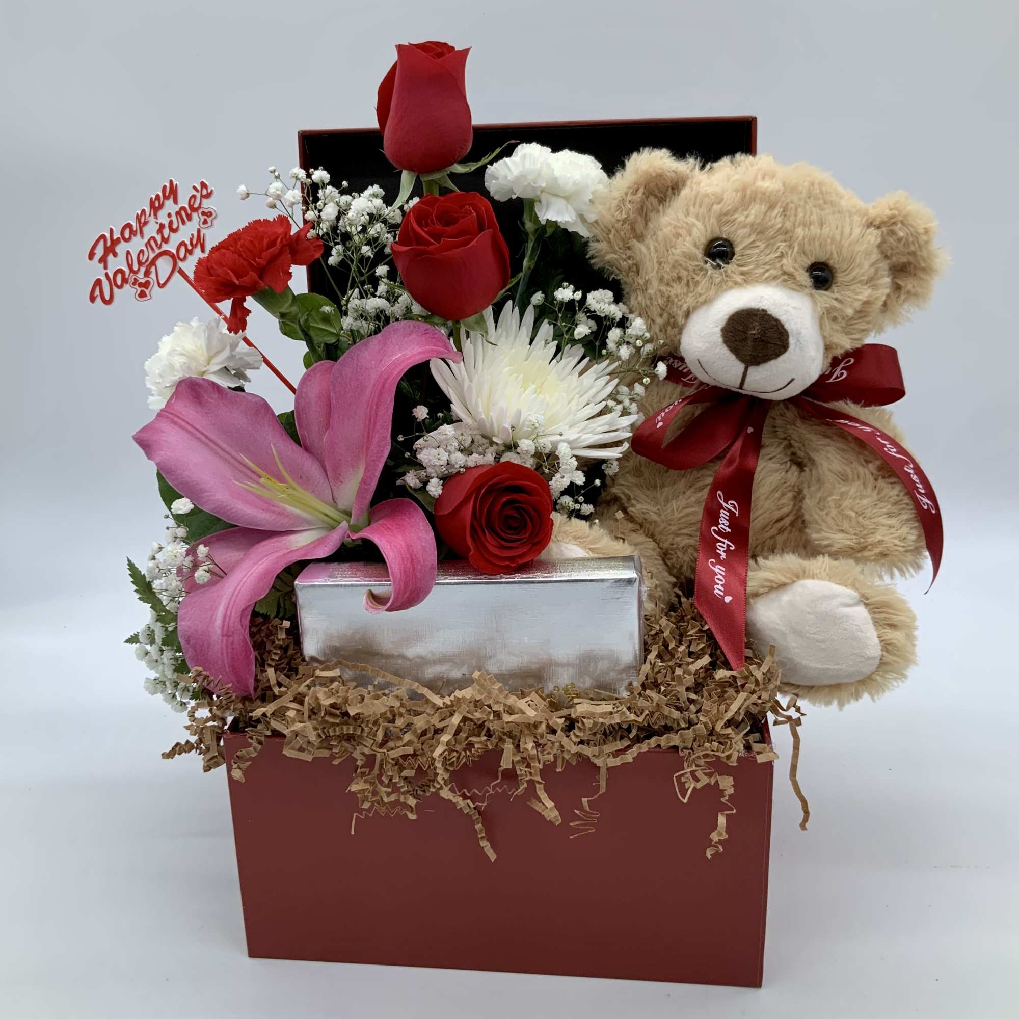 Gift box with red roses, pink lily, and teddy bear