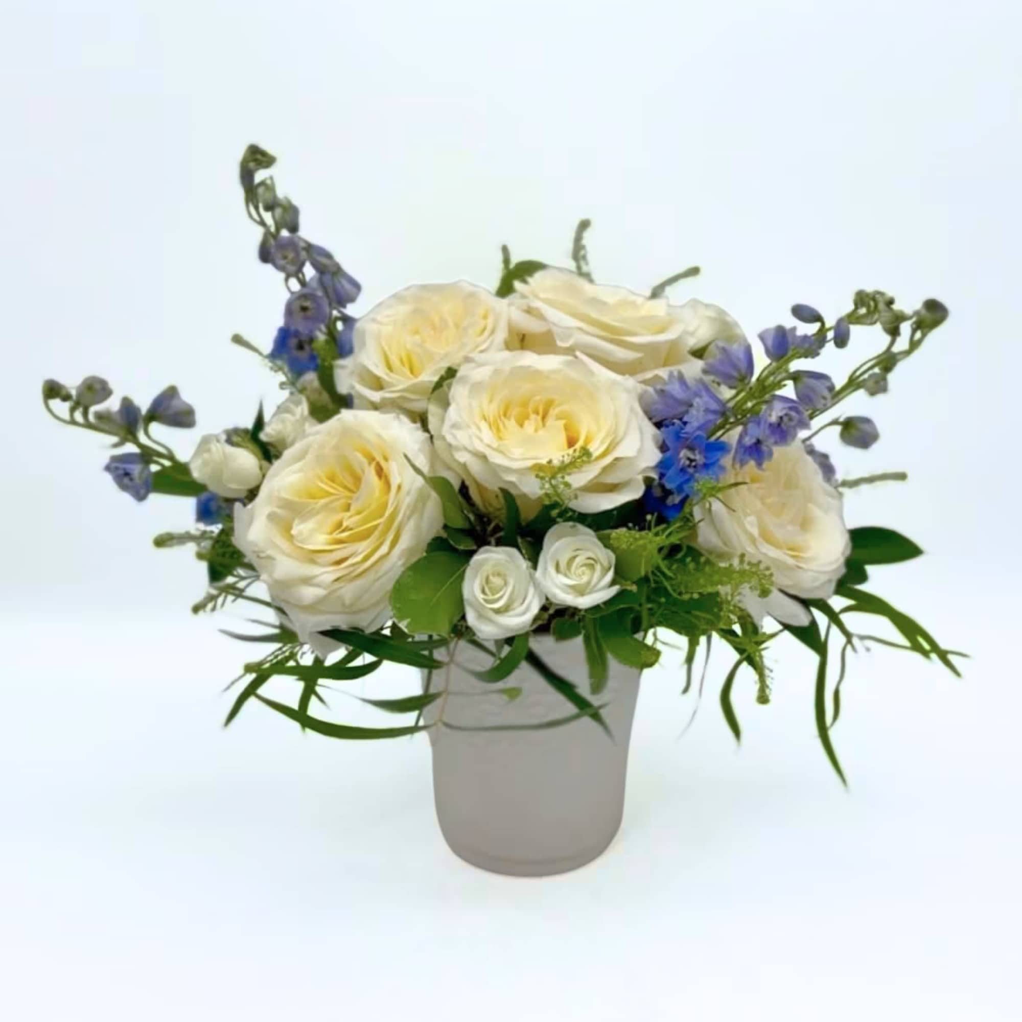 This modern display highlights 'Candlelight' garden roses (our owner's favorite variety), accented