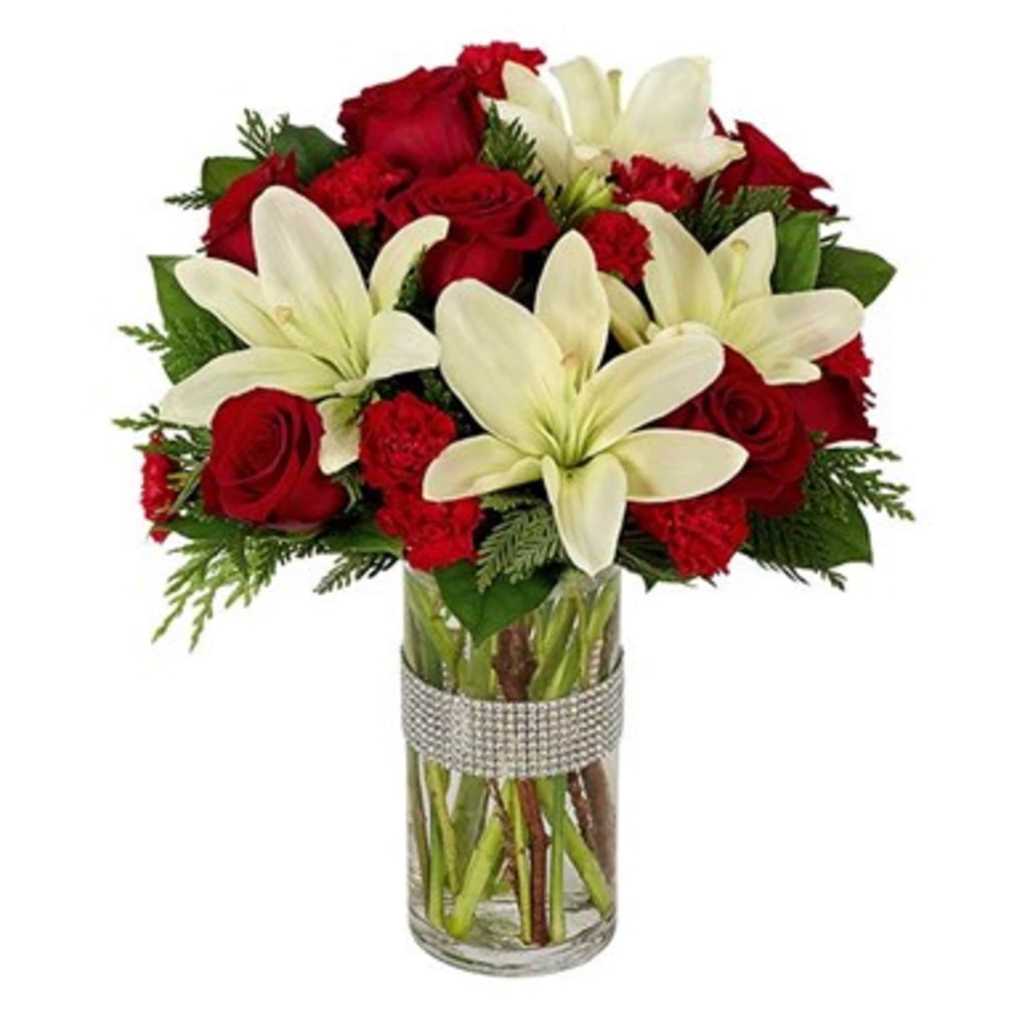 Red roses and white lilies in a clear glass vase