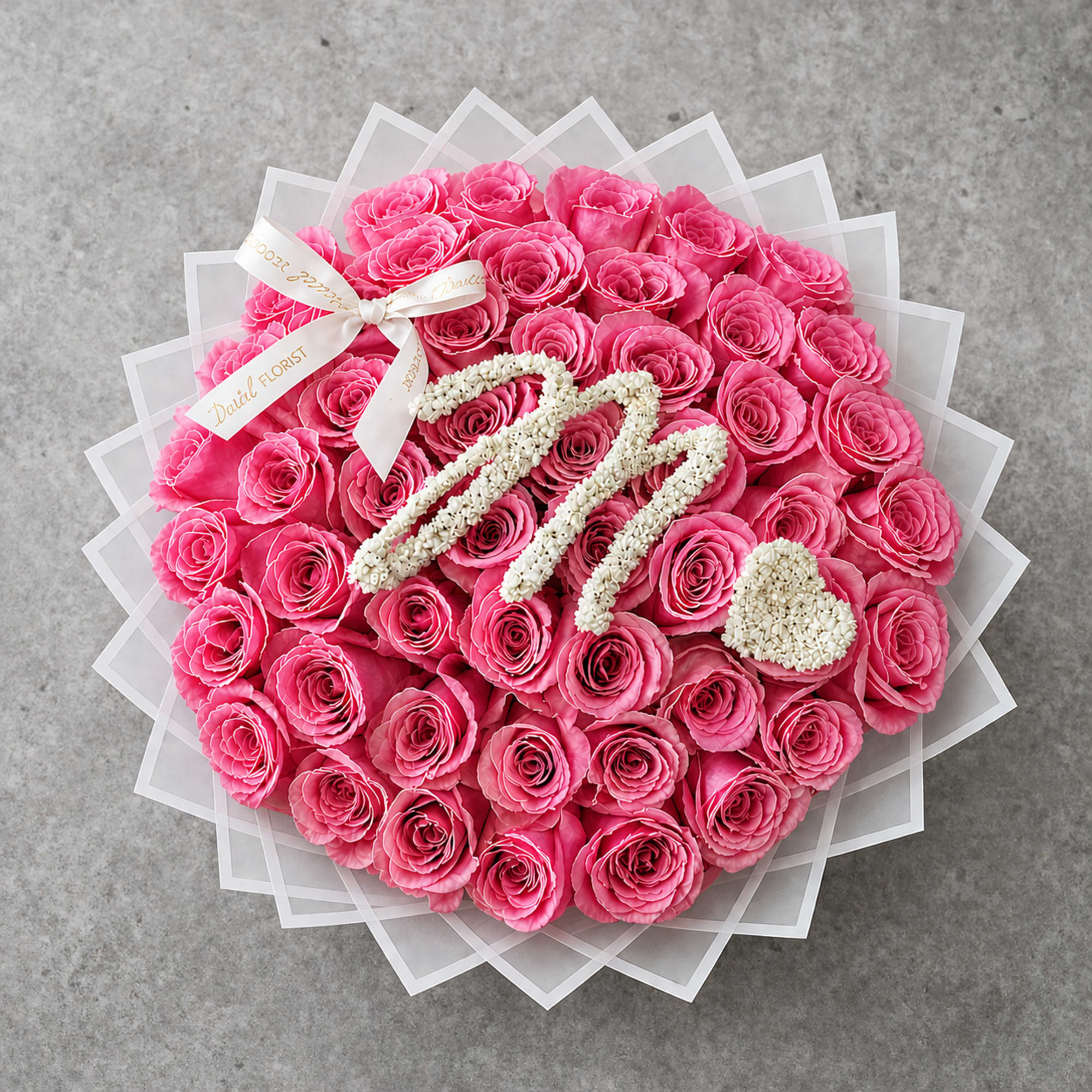 Our 25/50/75 Stem Rose Bouquet with custom baby's breath initial and baby's