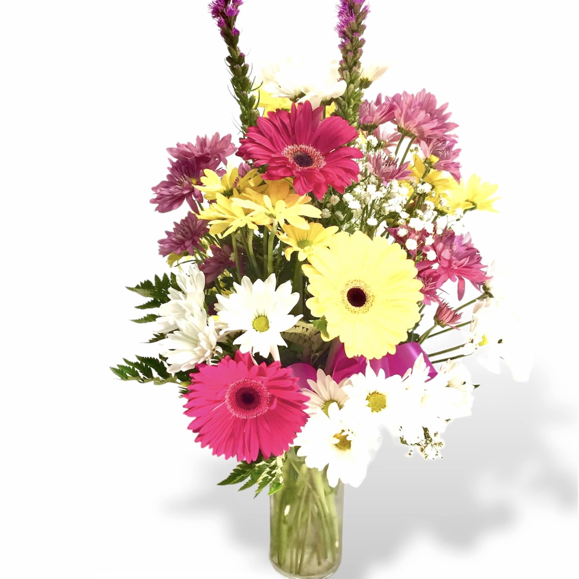 Dashing daisiesArranged in a glass cylinder vase filled with dashing Daisy is