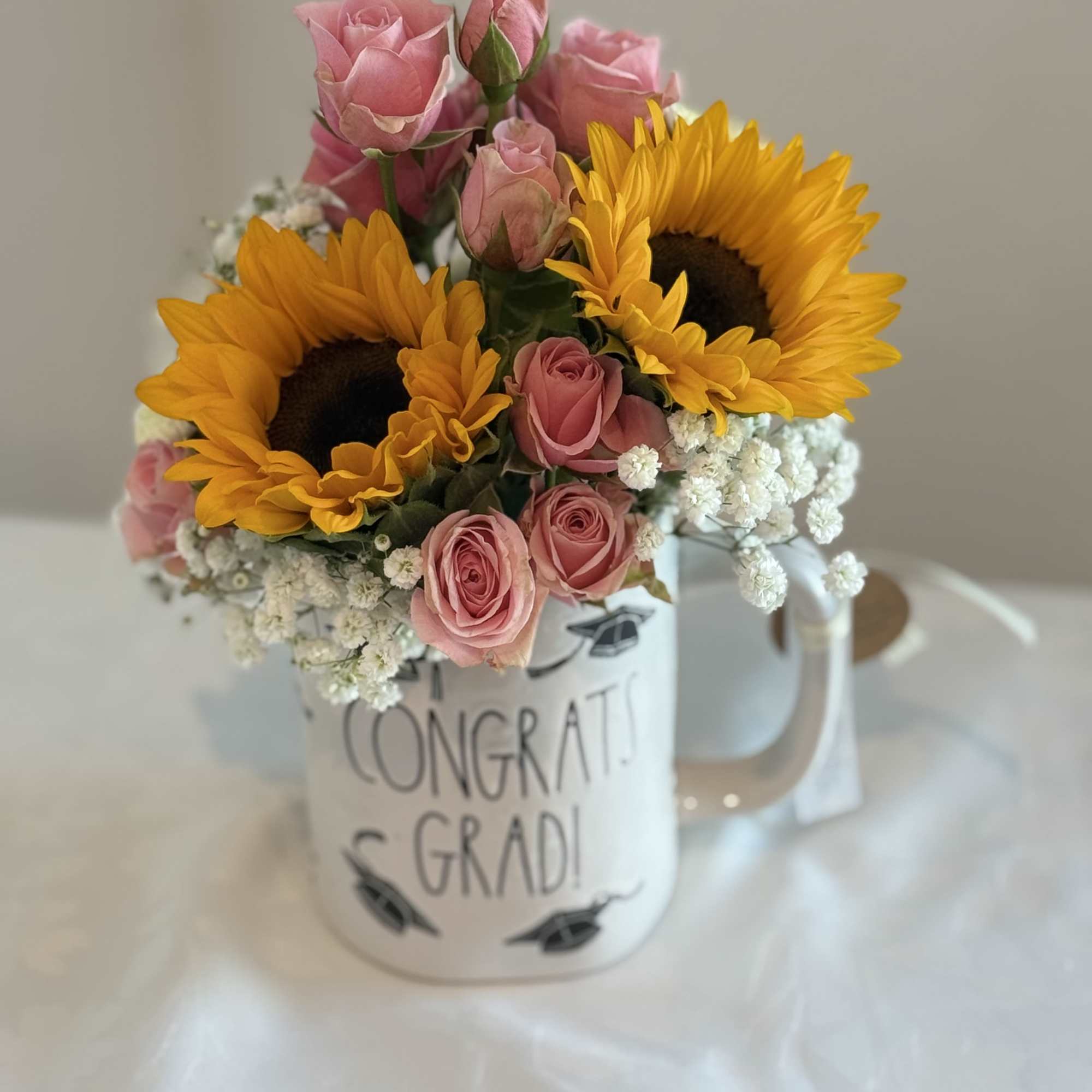 Coffee mug filled with mix flowers 