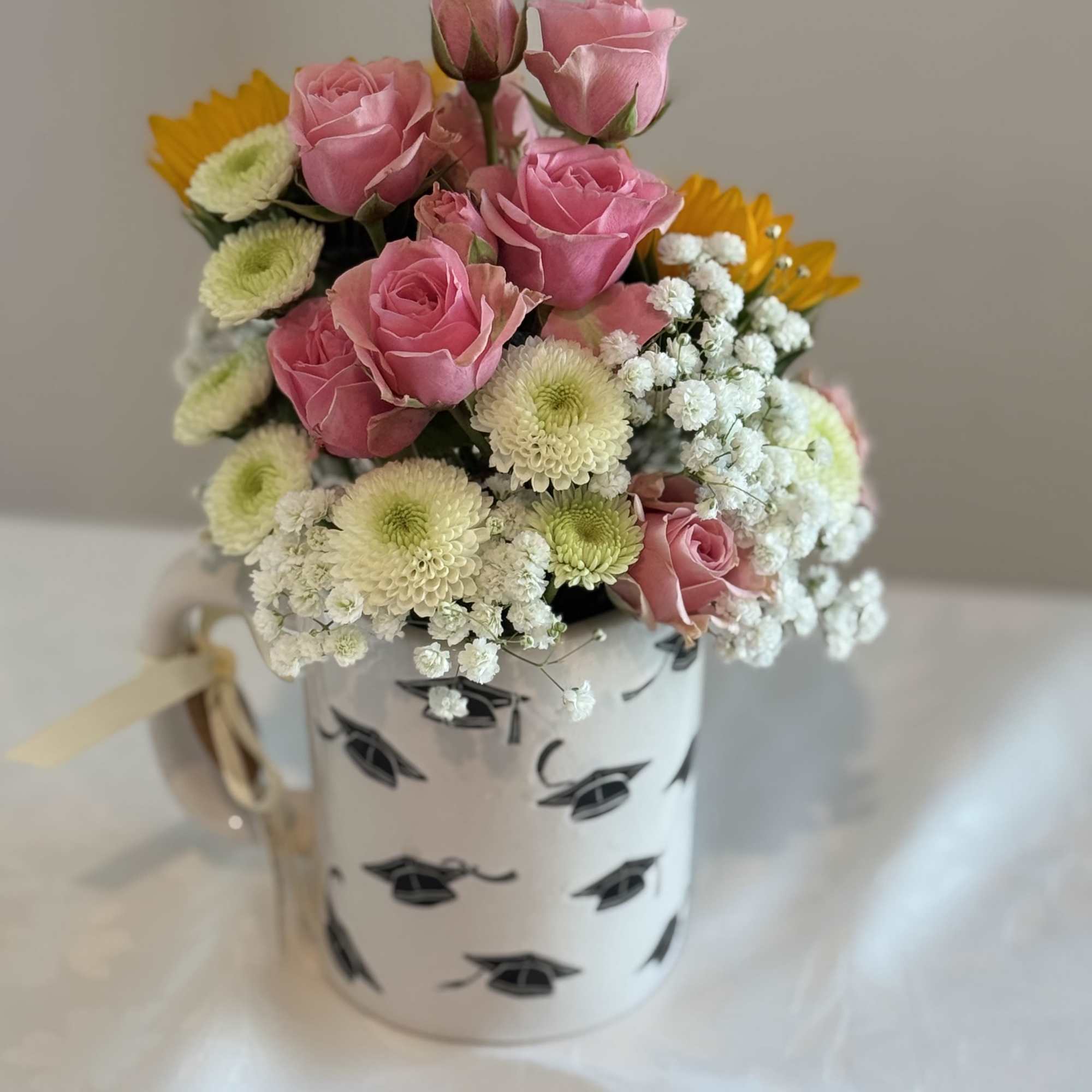 Coffee mug filled with mix flowers 