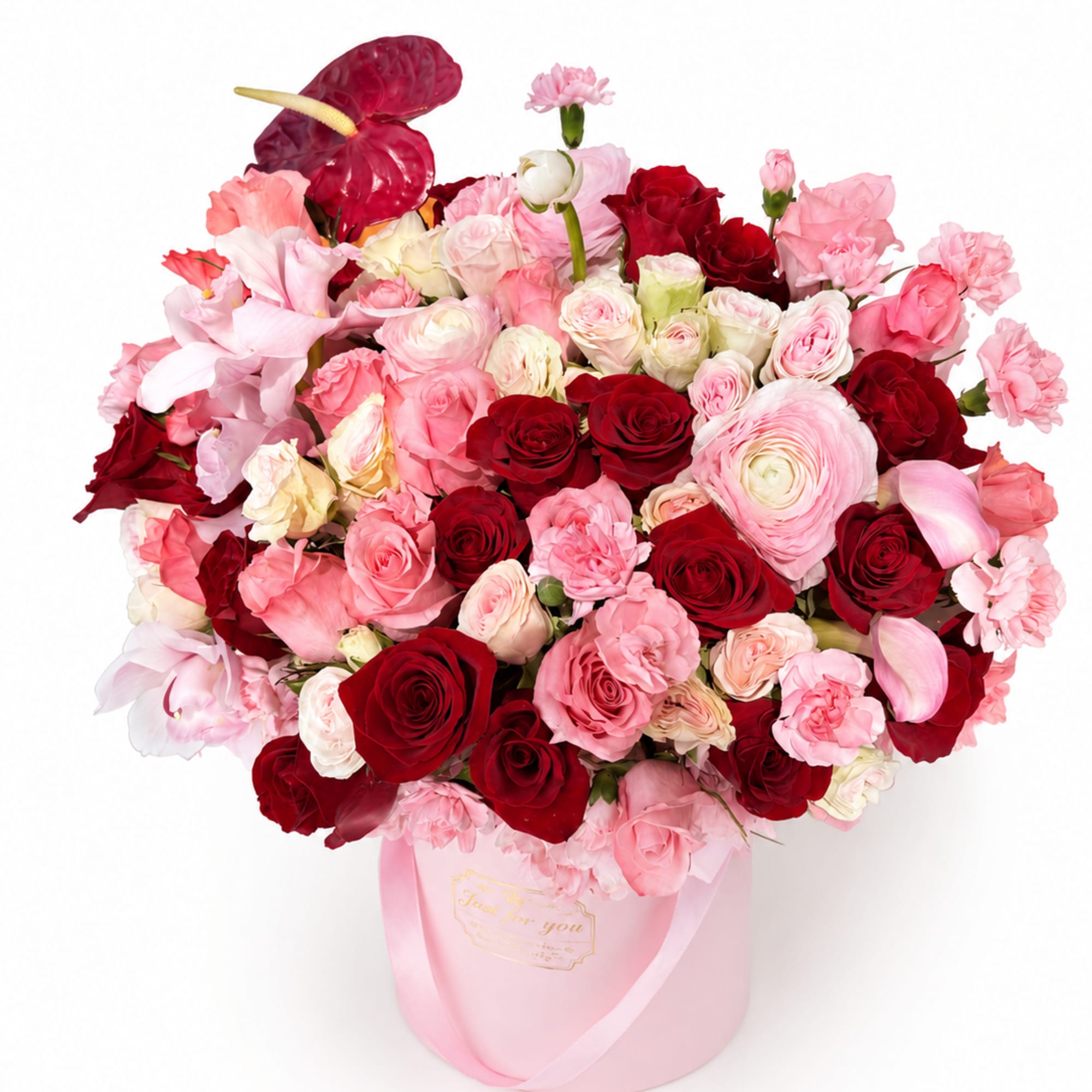 A romantic luxury arrangement designed with premium roses, ranunculus, orchids. This arrangement