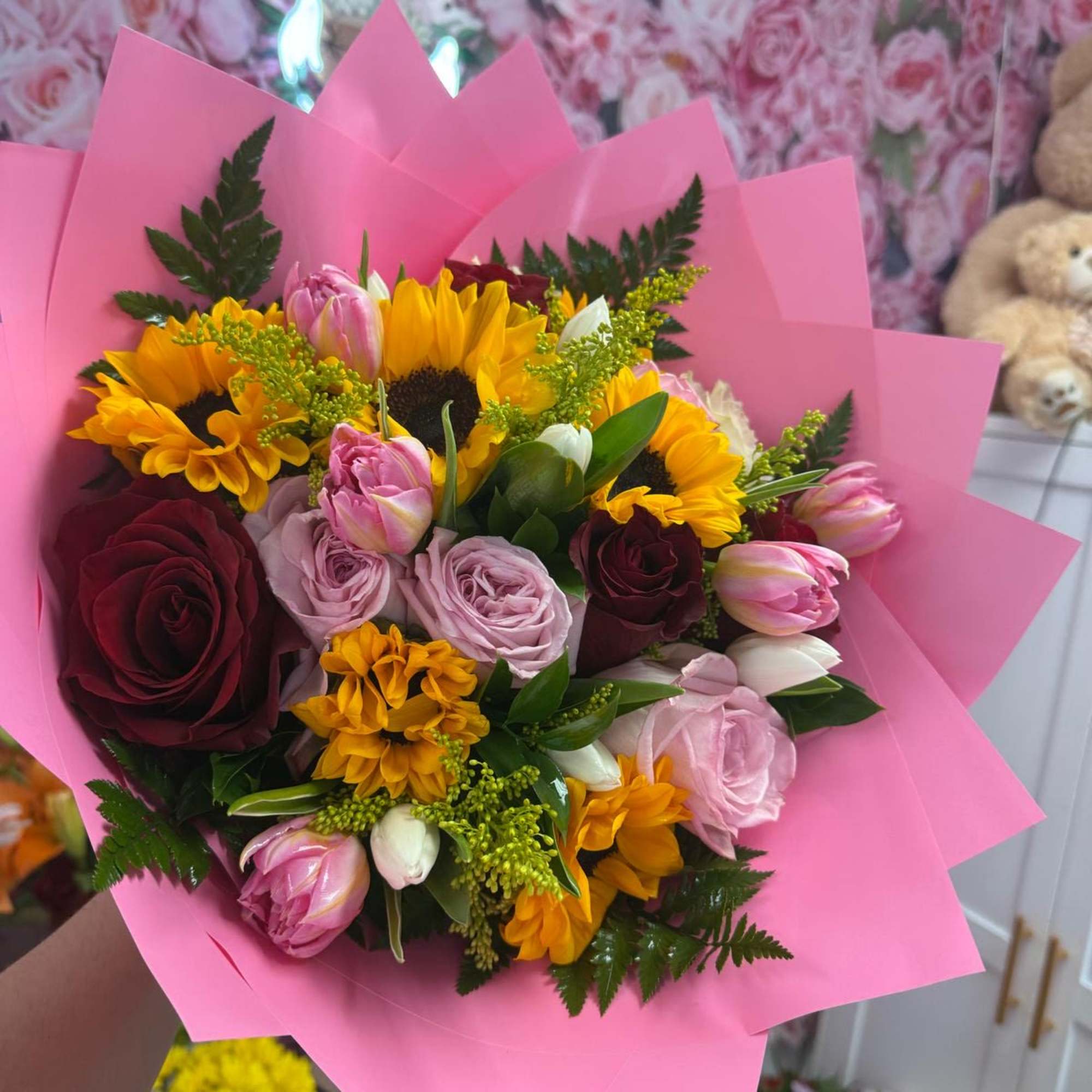 A beautiful wrap with roses, sunflowers and Tullips 