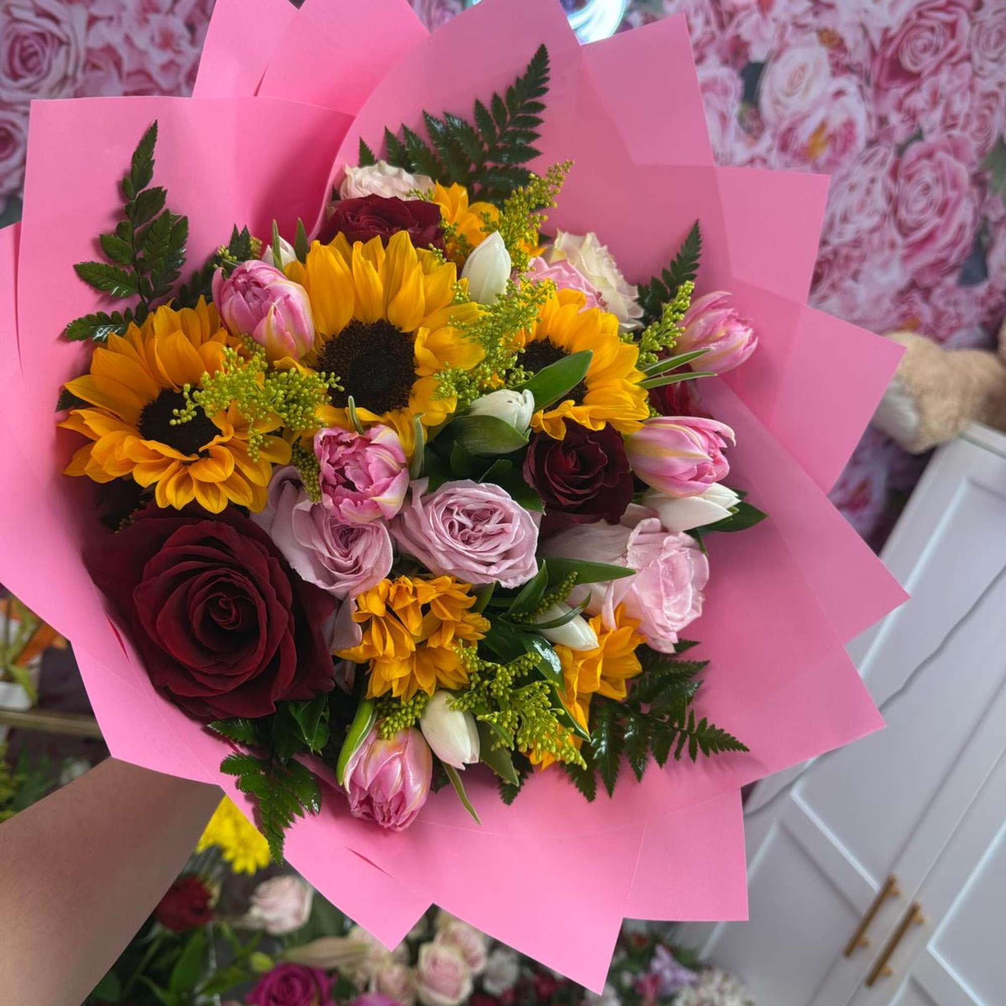 A beautiful wrap with roses, sunflowers and Tullips 