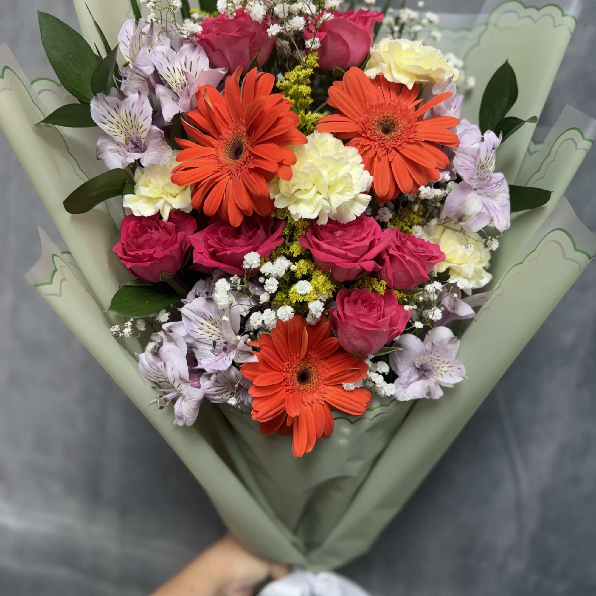 Vibrant spray roses and  gerbera with alstroemeria, carnations and white accents