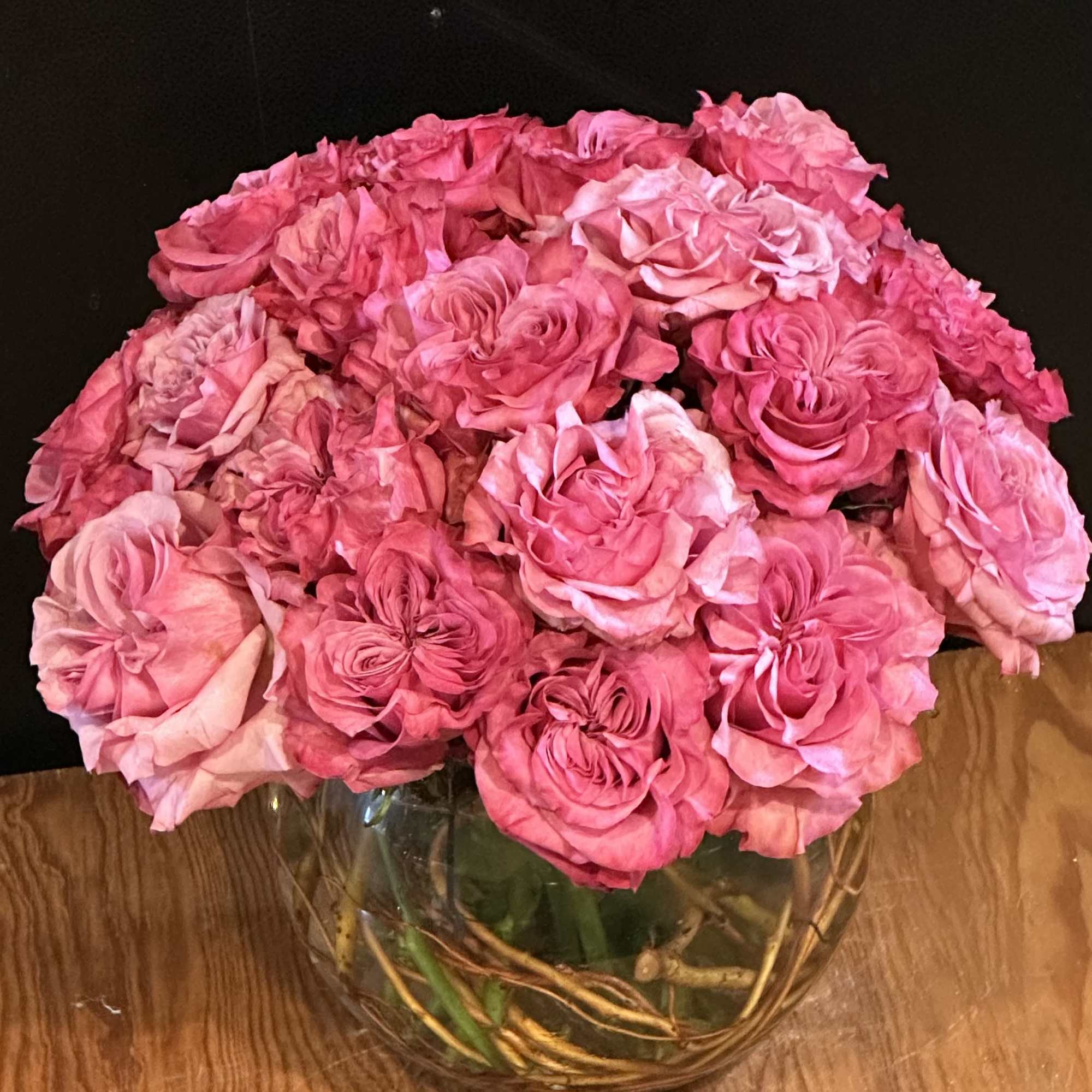 12 deep pink cabbage roses exquisitely arranged in a 6" bubble bowl..
Height: