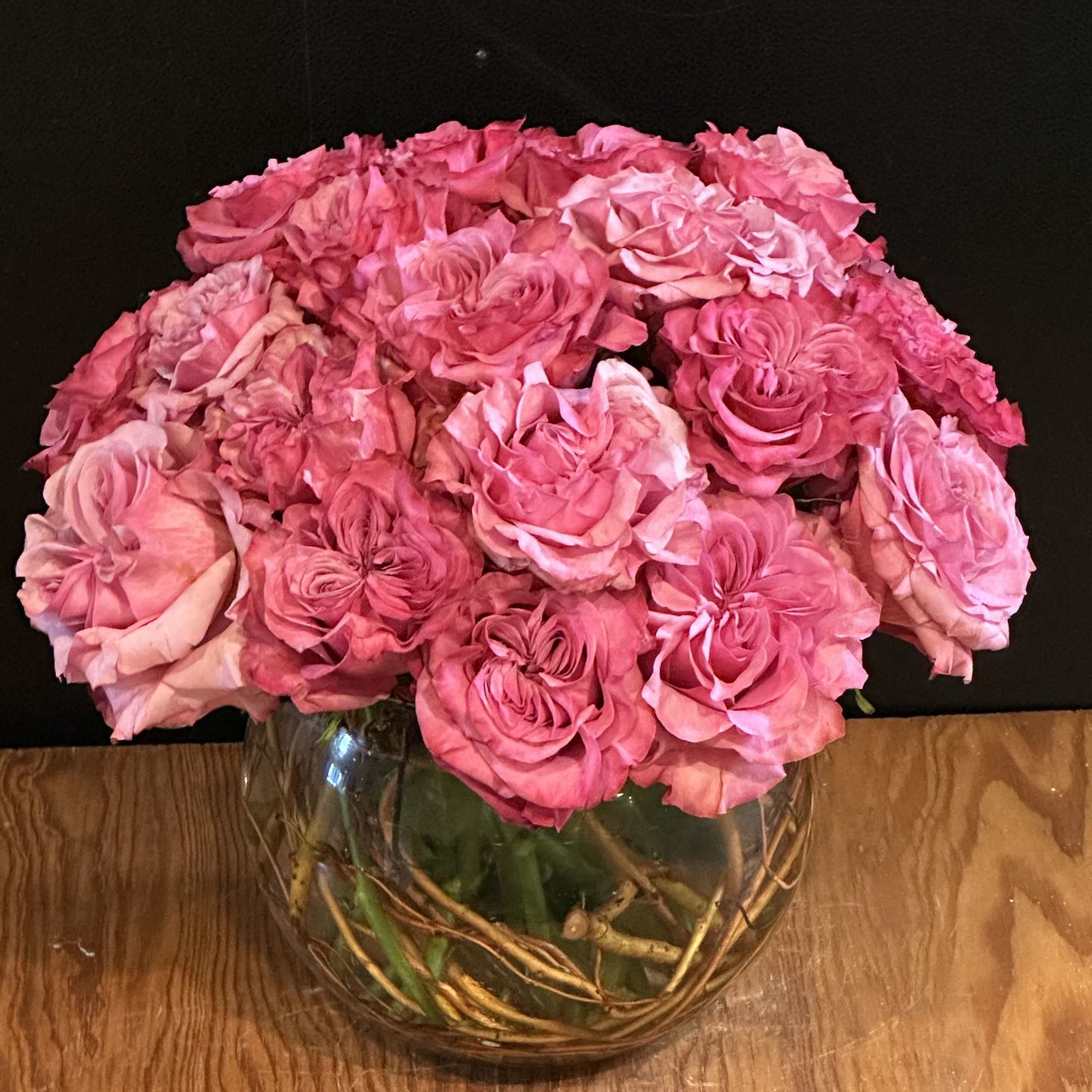 12 deep pink cabbage roses exquisitely arranged in a 6" bubble bowl..
Height:
