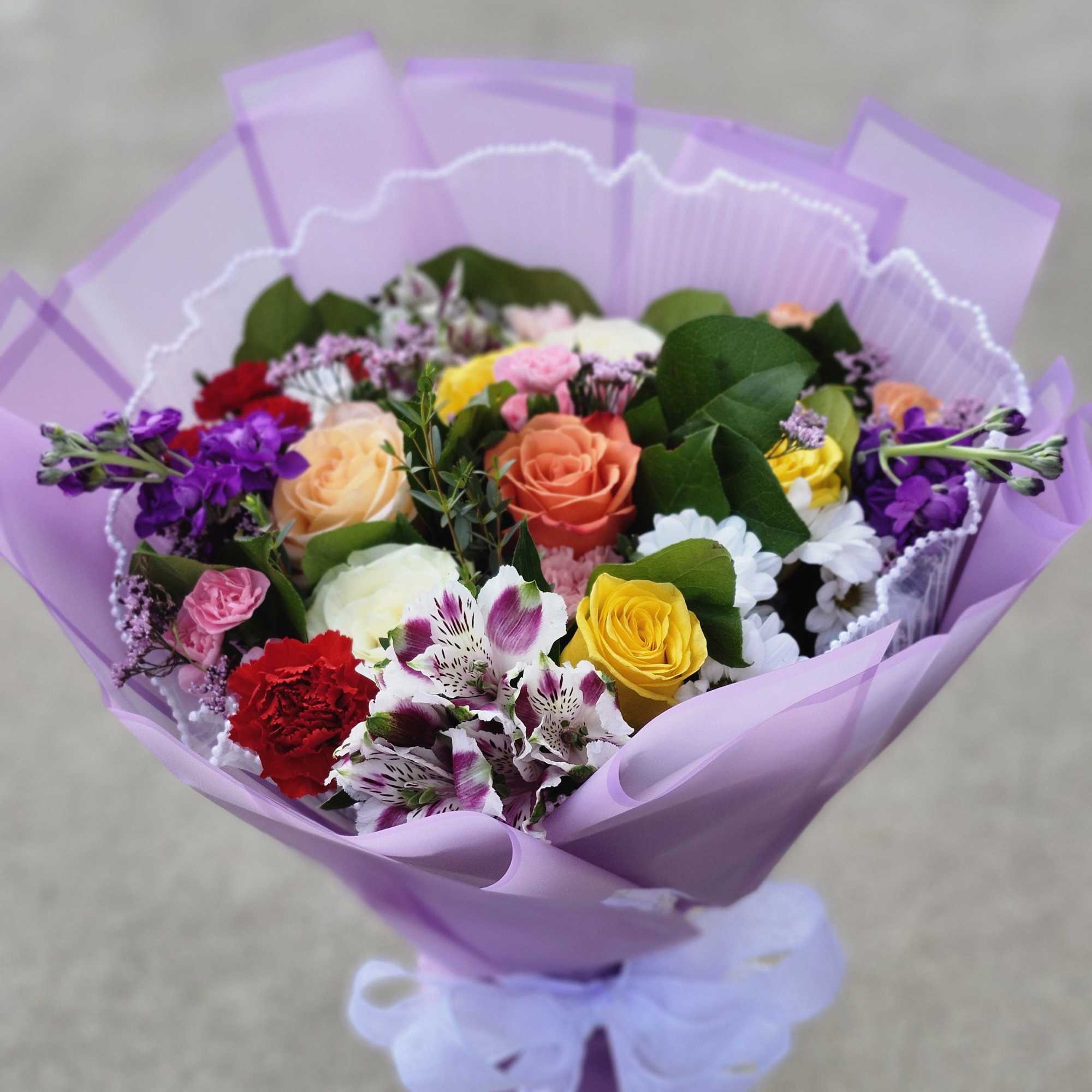 Paper wrapped hand bouquet with no vase will be provided with wet