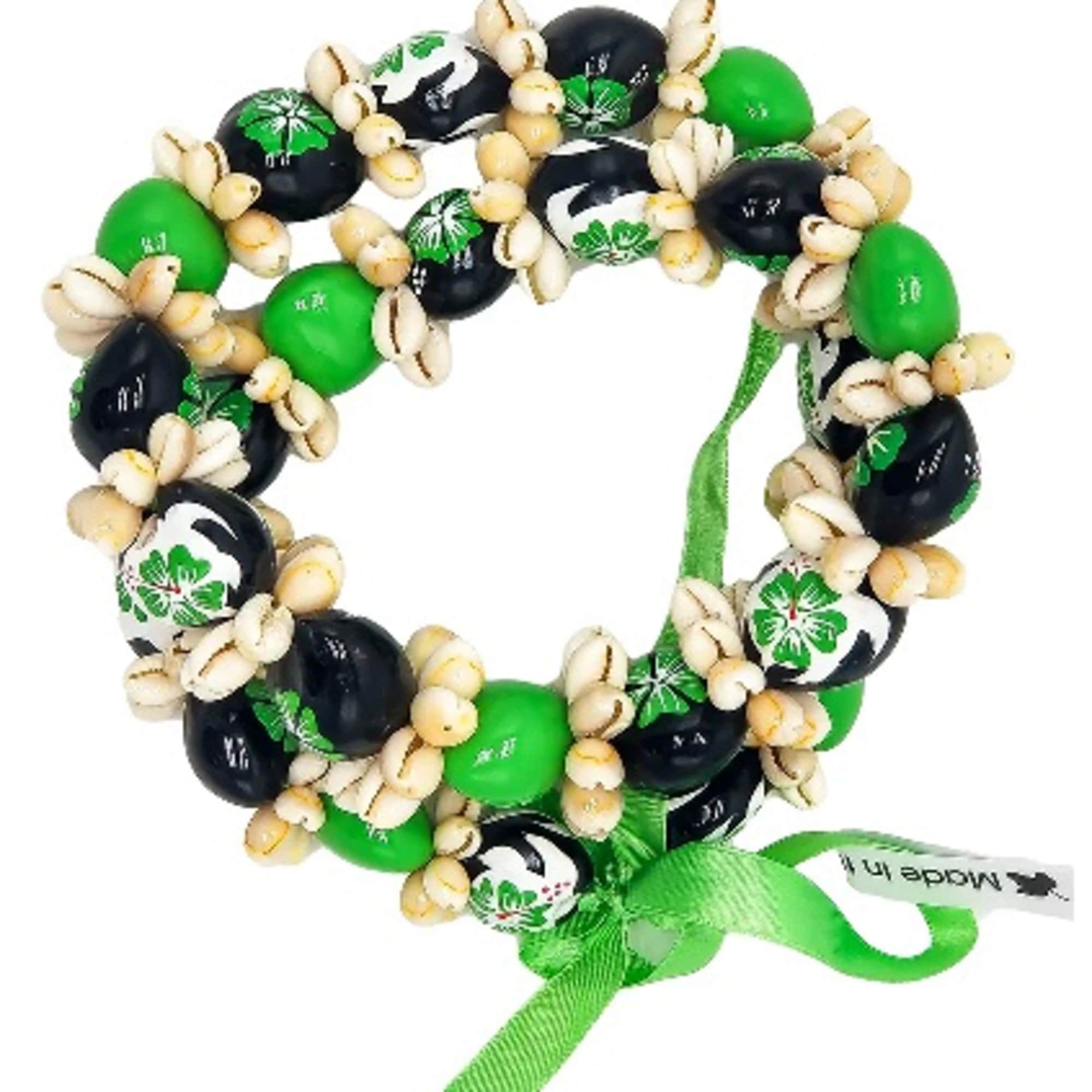 Green and black beaded bracelet with shell accents and a ribbon tie