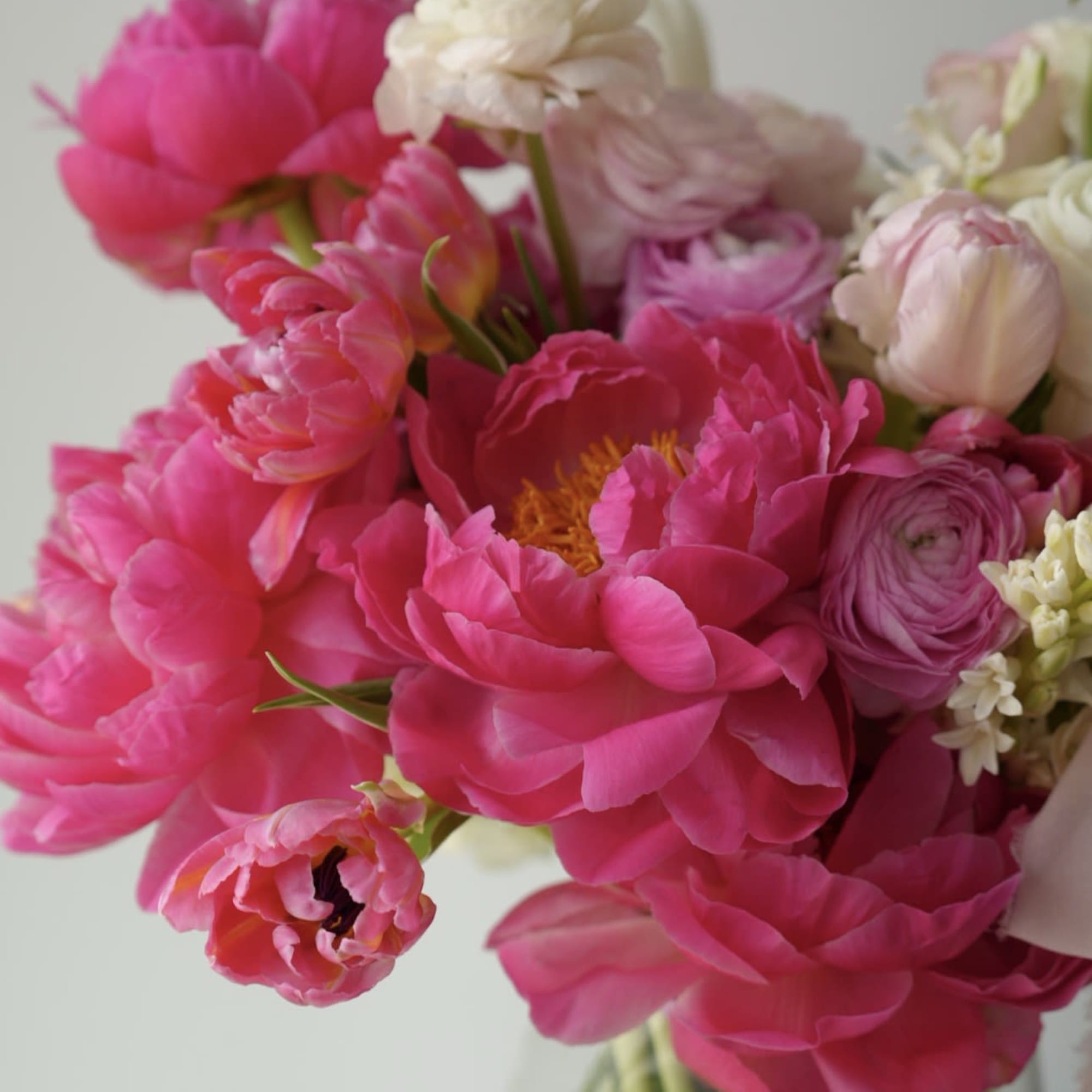 A soft and romantic spring arrangement in layered shades of blush pink