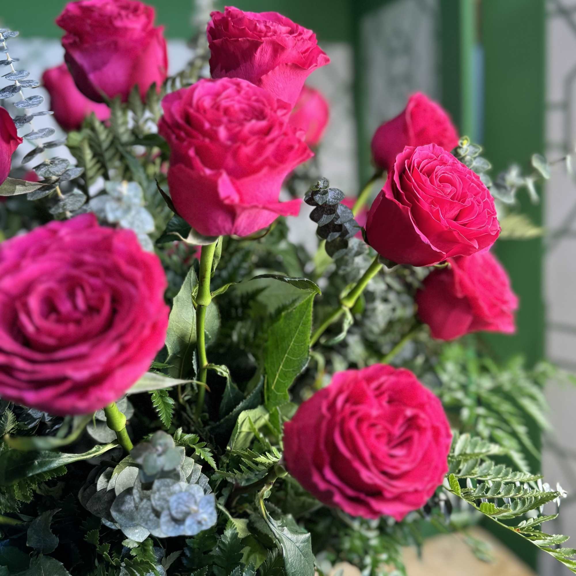 Bouquet of bright pink roses with silvery foliage