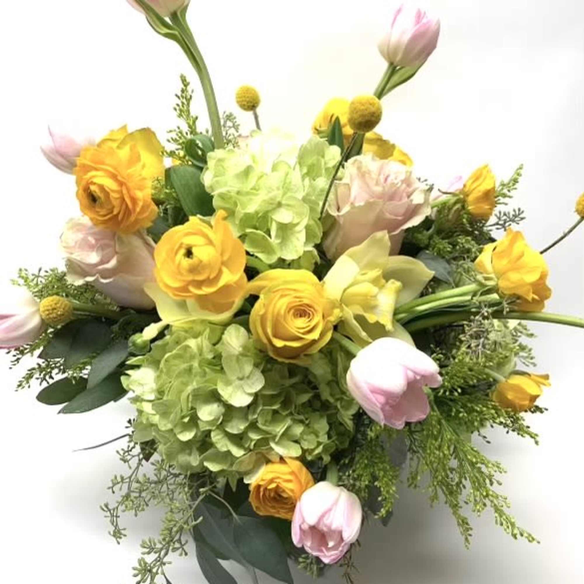 Bouquet of yellow and pink flowers with green hydrangea on a white background
