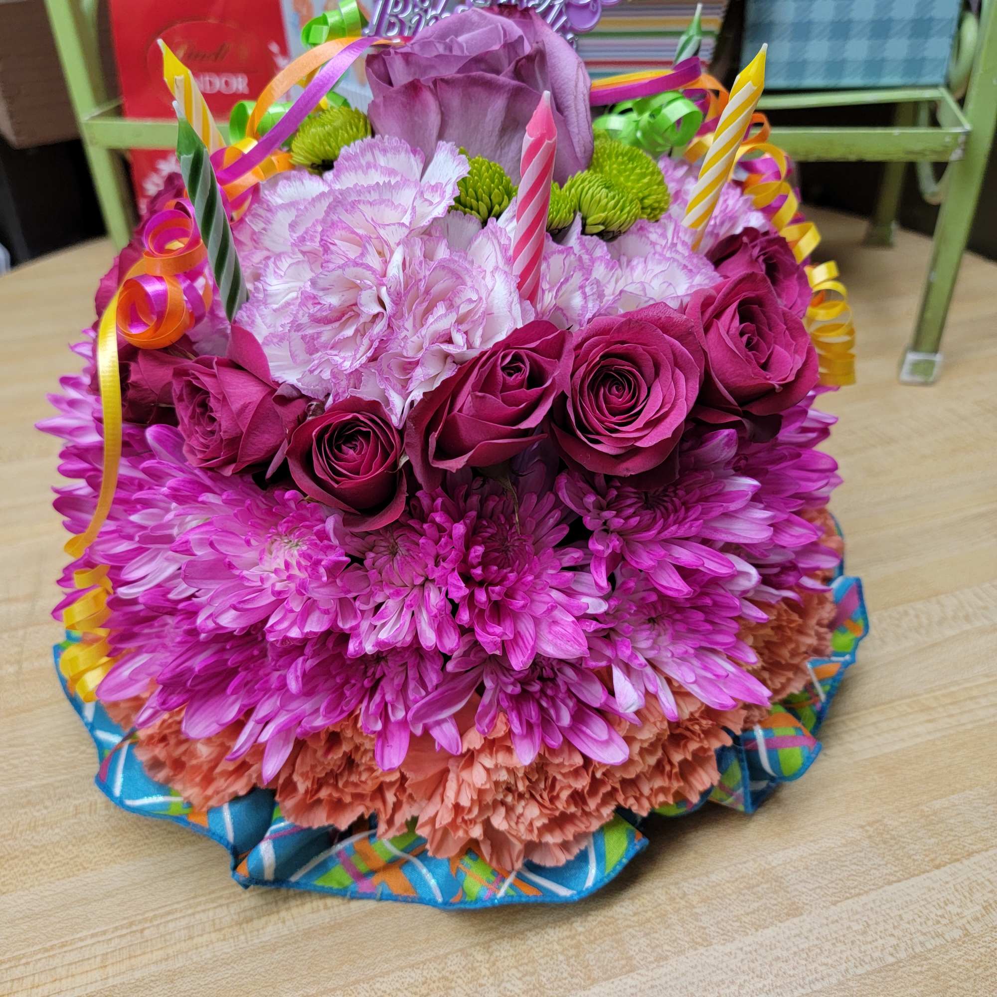 Colorful birthday bouquet with roses, carnations, and candles