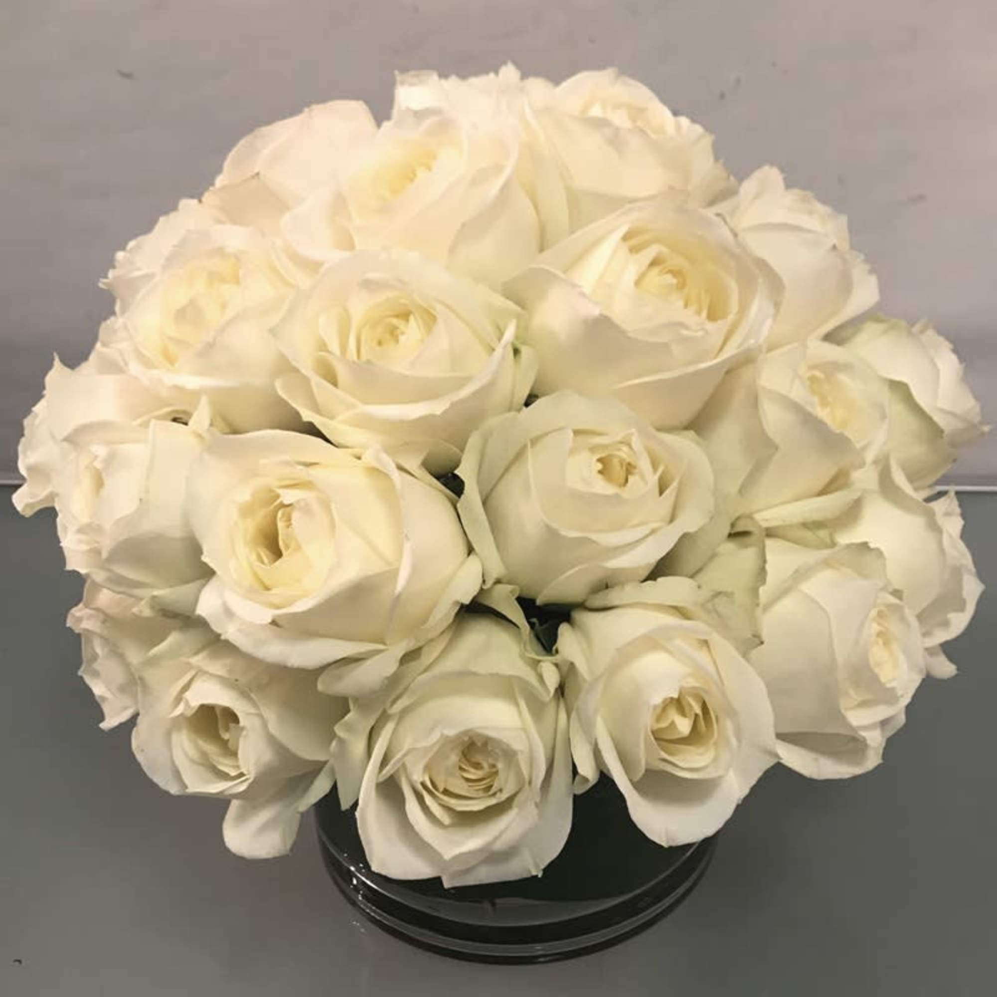 Make a bold statement with this elegantly simple design. White roses symbolize
