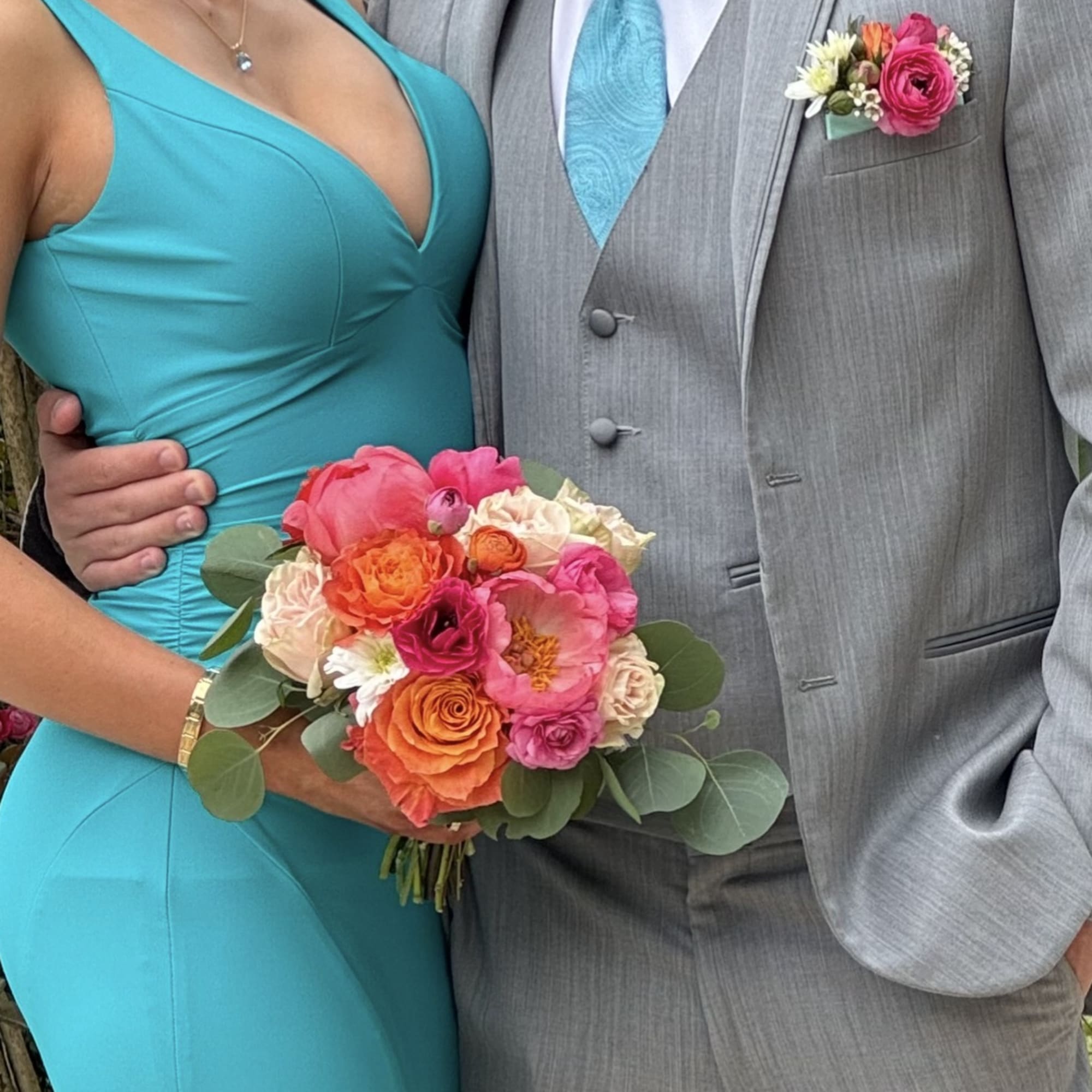 Your choice of bright, pastel, or neutral bouquet and matching boutonniere crafted