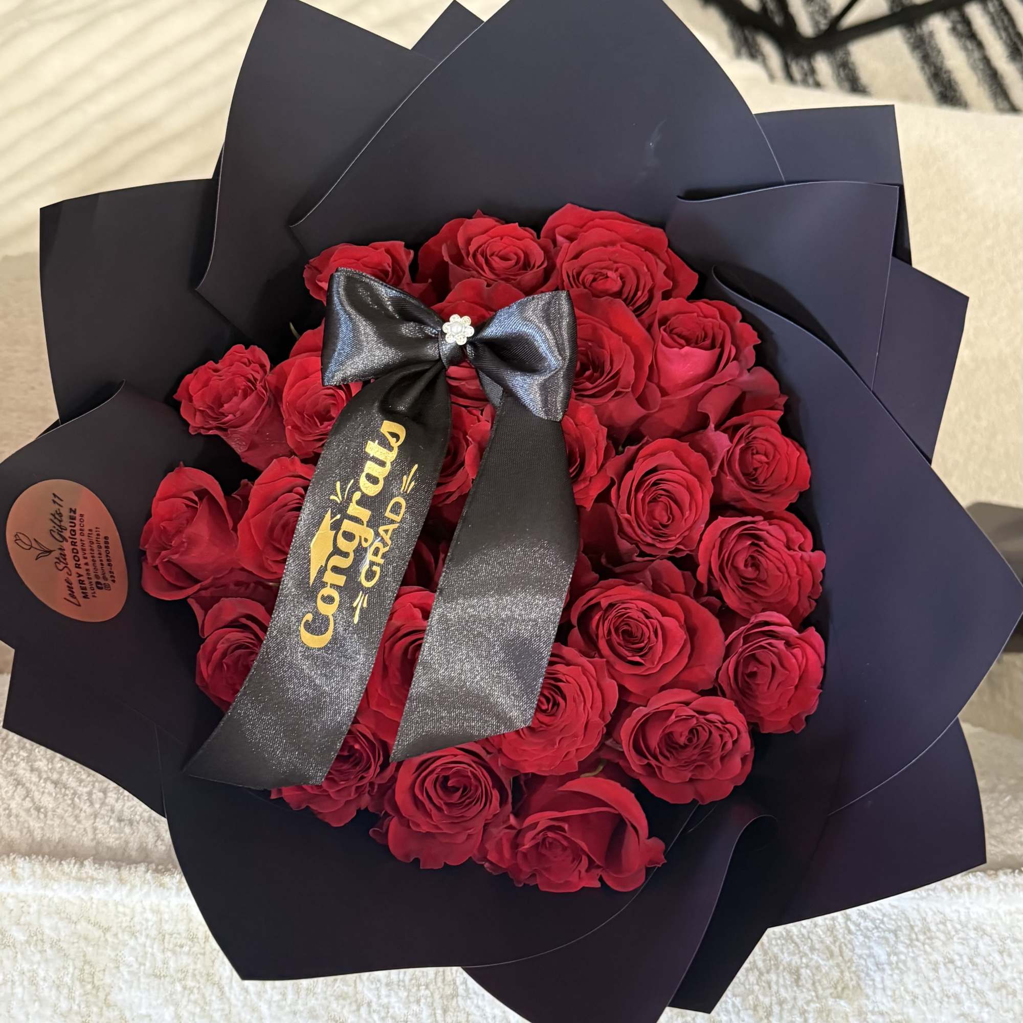 Celebrate their big achievement with a timeless Graduation Bouquet featuring two dozen